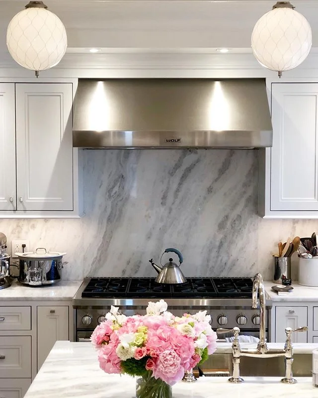 I was so lucky to find delicious quartzite slabs in a rare white hue for my own kitchen pictured here. (Quartzite is a natural stone that combines the durability of granite with the look of marble.) Finding them made an all white kitchen a reality fo
