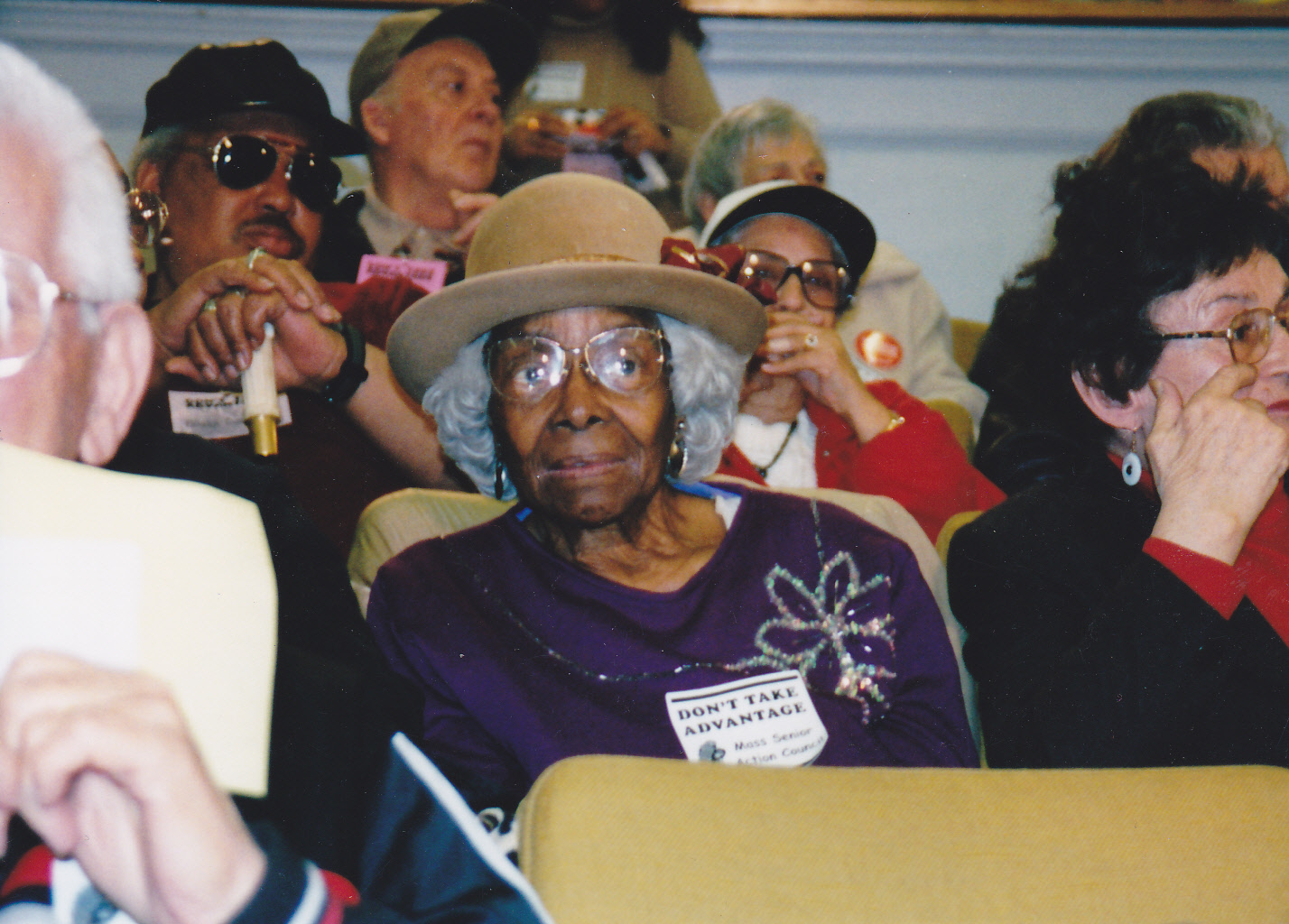 Seniors sitting in a crowd
