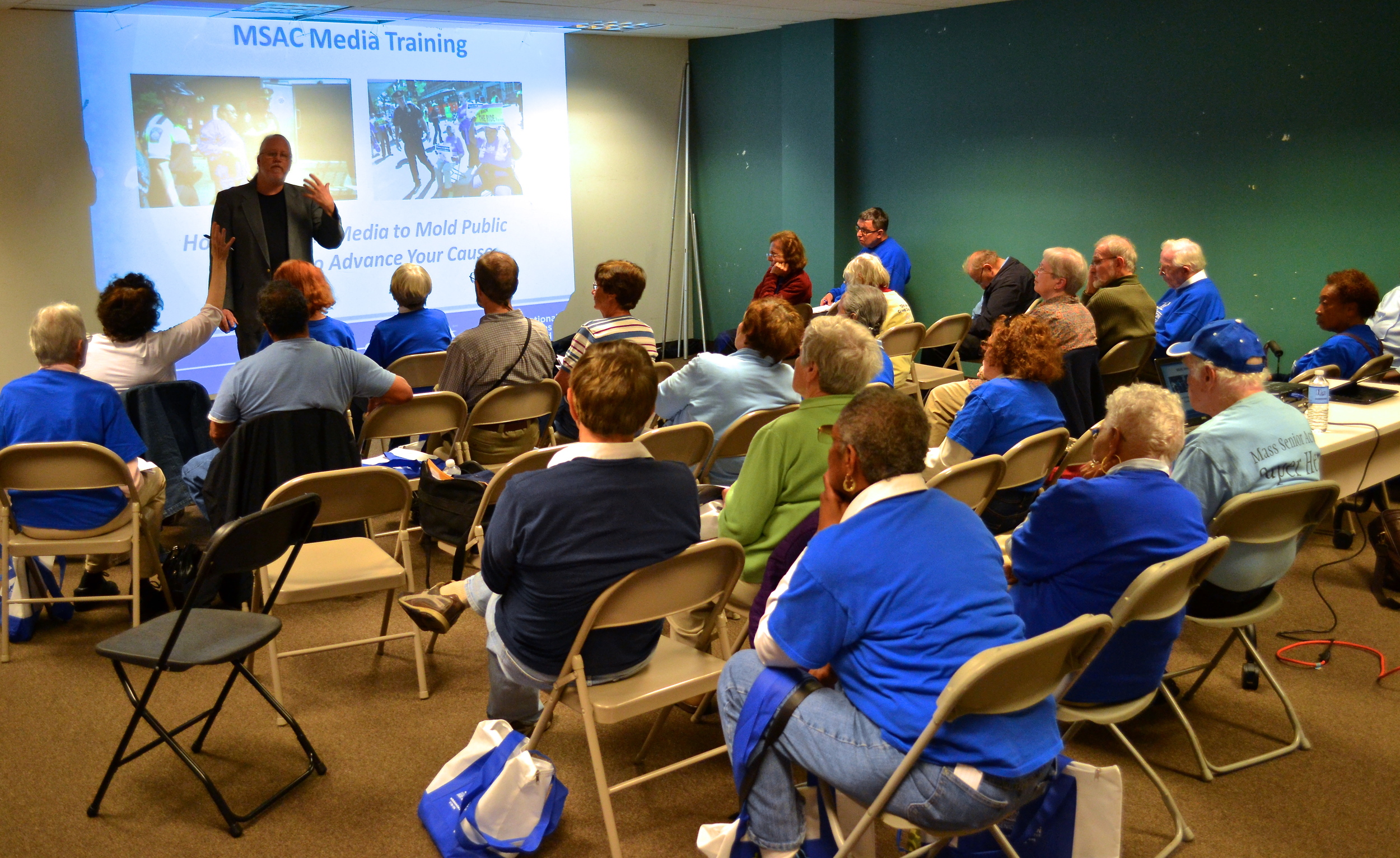 Seniors gathered in a room for media training