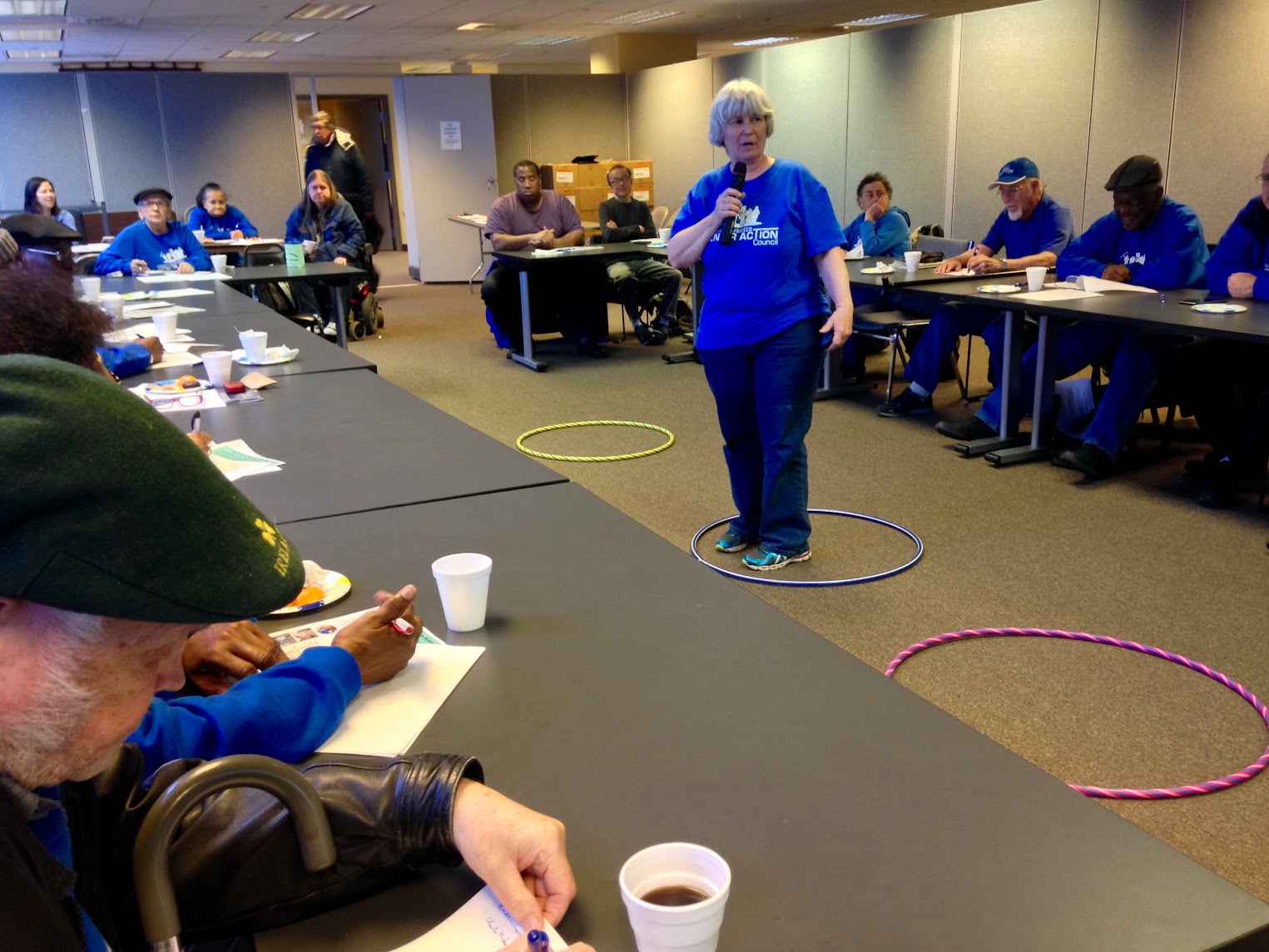 woman holding a mic in a conference room