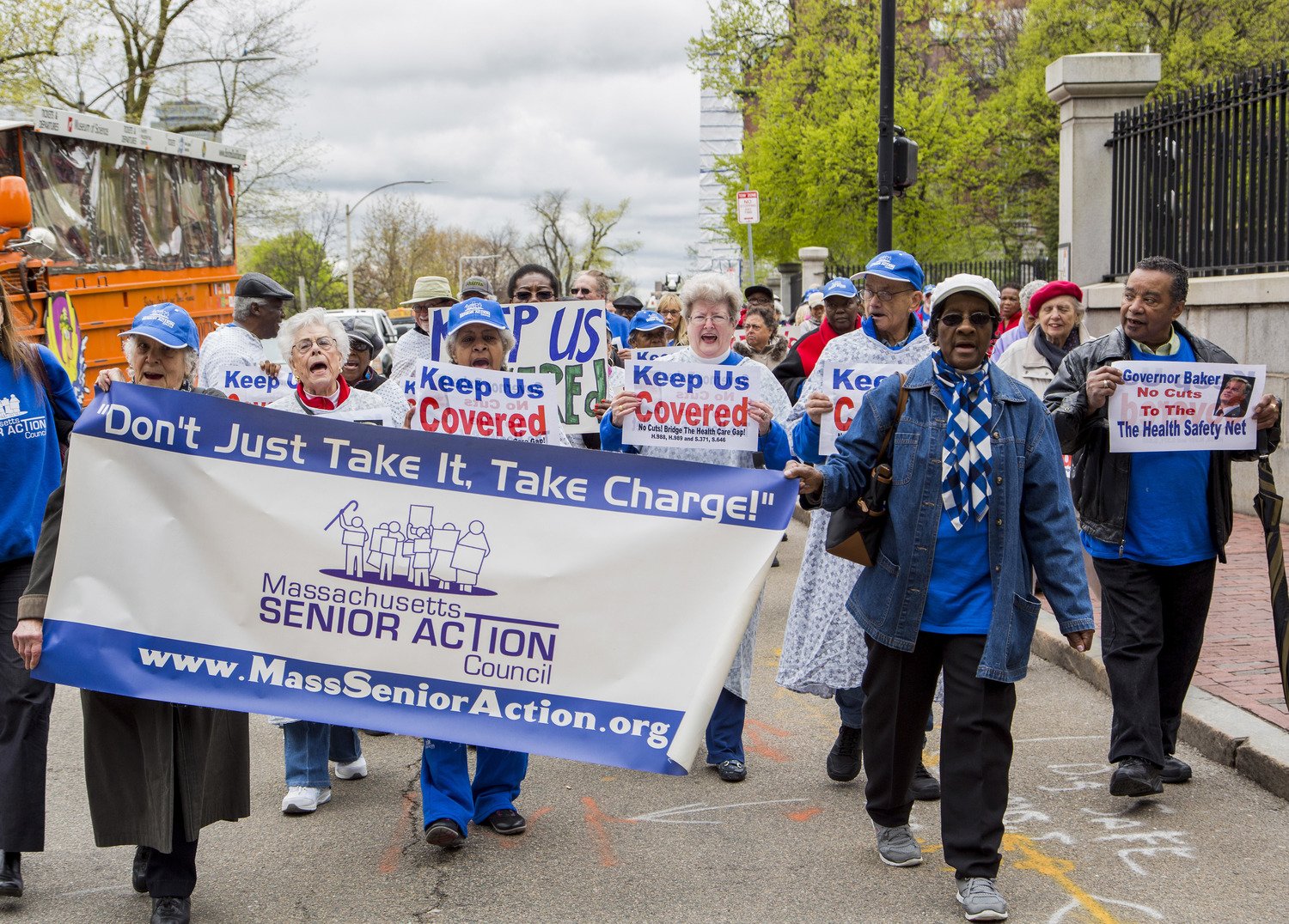 Seniors protesting carrying signs .jpeg