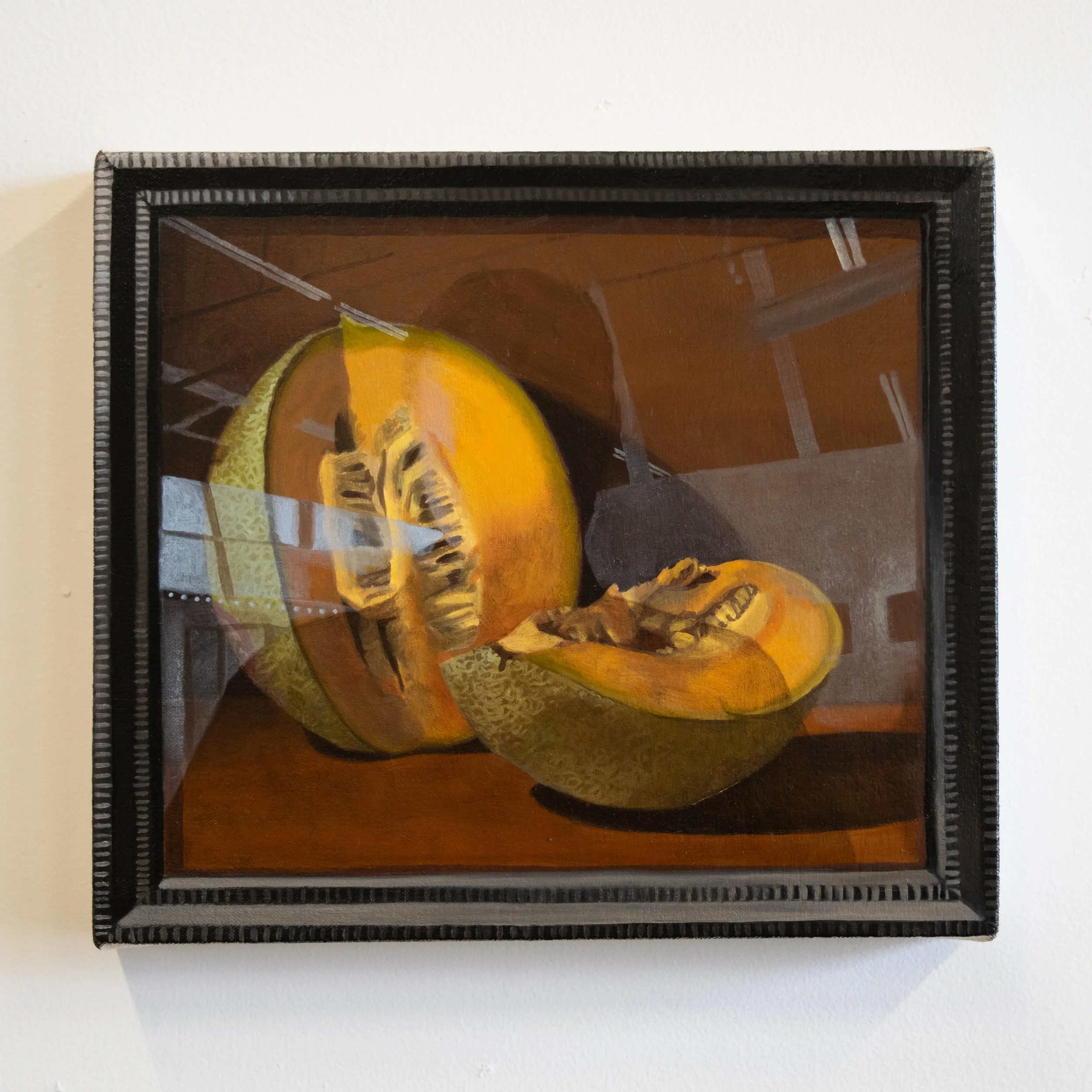 still life with cantaloupe and trompe l'oeil picture frame