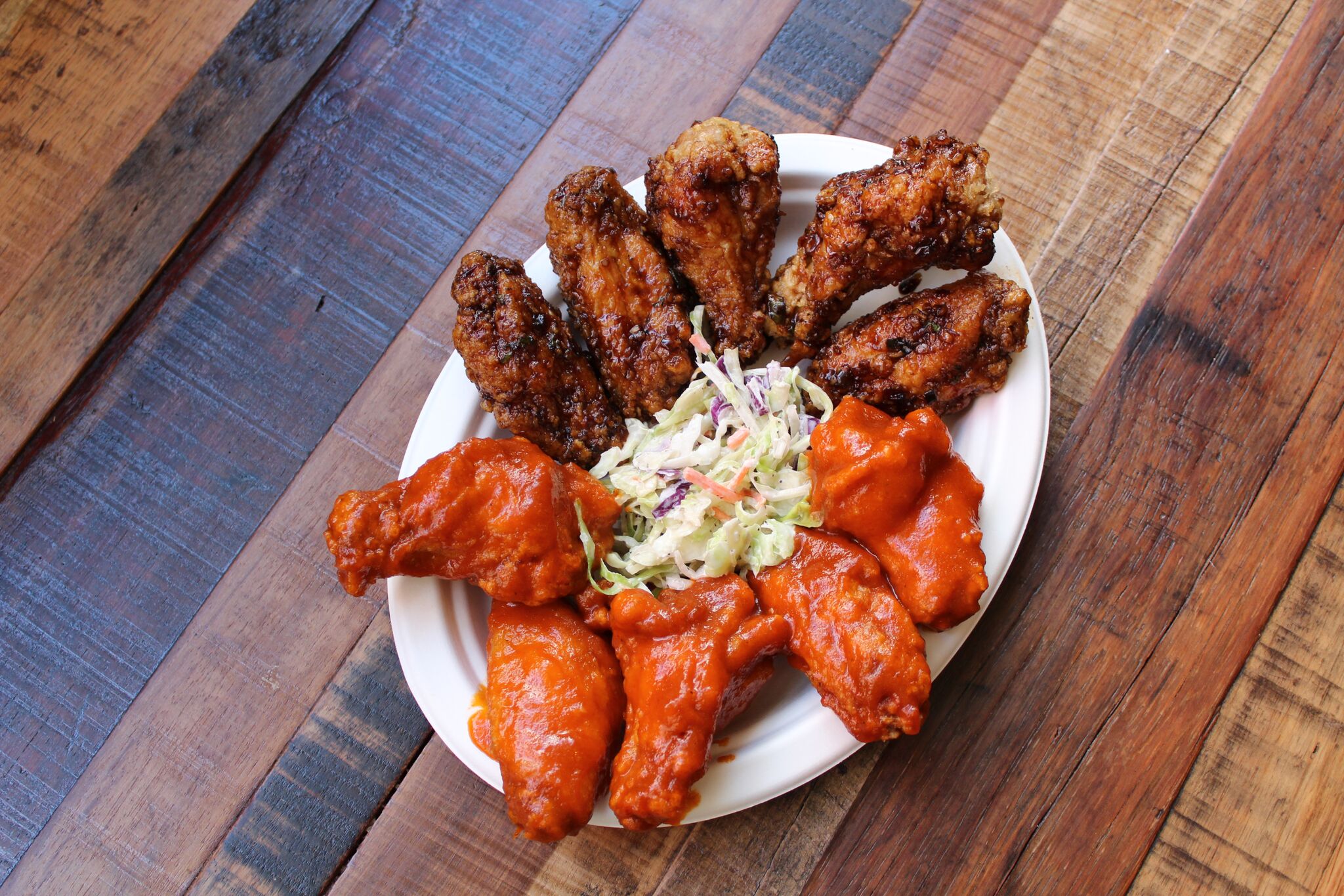 Bring your best wingman to devour some cluckin' good wings together at WINGMAN, located at 4th Street Market in downtown Santa Ana, CA | photo courtesy of 100eats