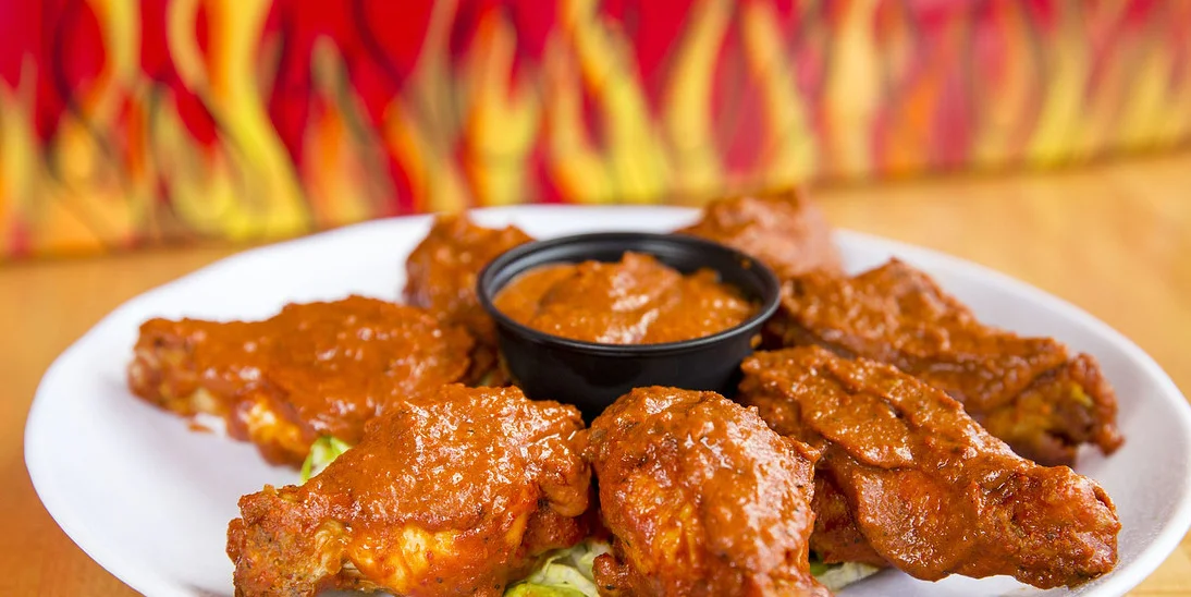 These perfectly crispy Level 7 Alarm wings from Wing Dome will leave you desperately searching for a glass of milk | photo courtesy of The Wing Dome