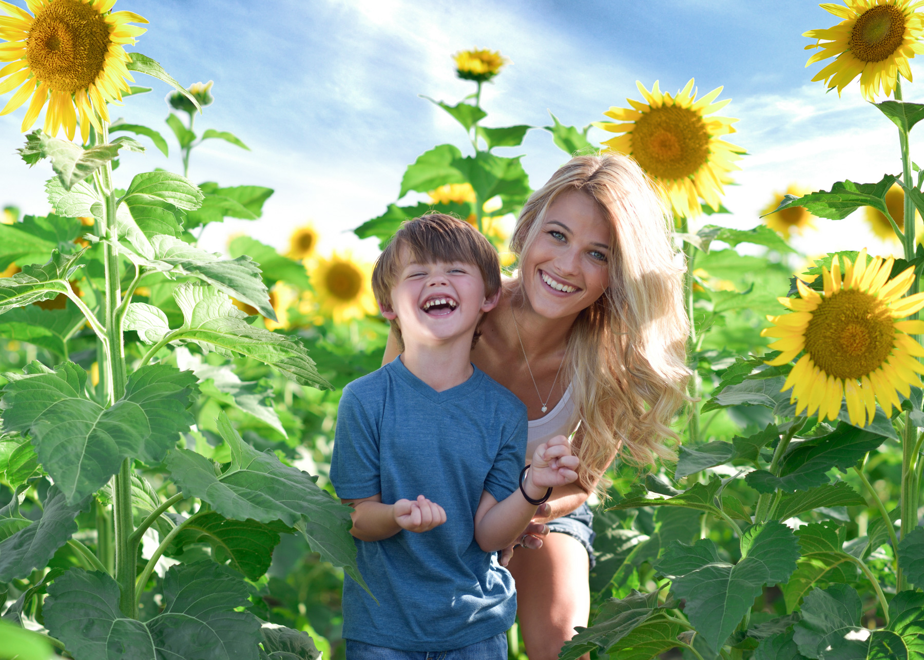 kids and family sunflower blue sky.jpg