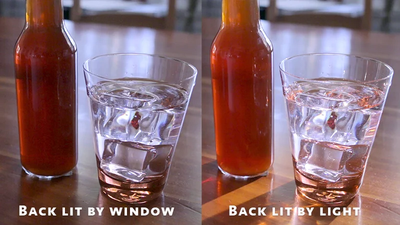 Backing lighting transparent liquids and objects is the best way to illuminate them. Here the soft daylight from a window and a focused spot light make them pop.