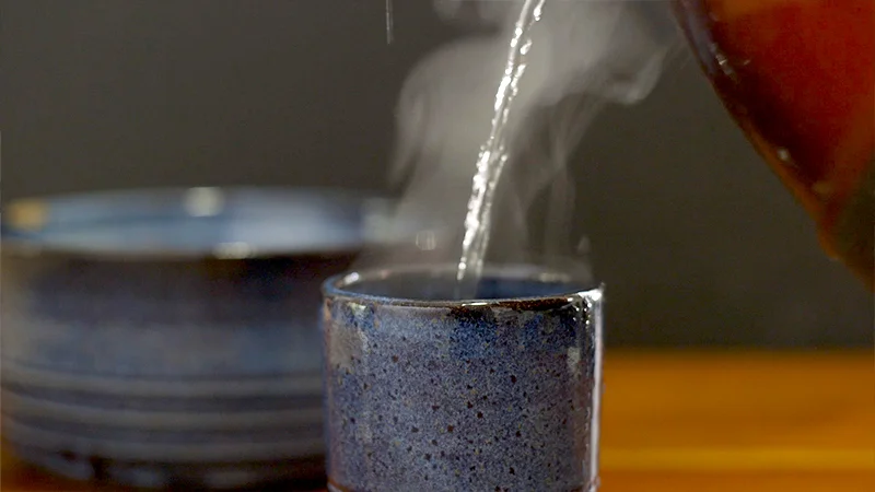 The steam from the cup and the hot water poured in pop when lit 3/4 back.