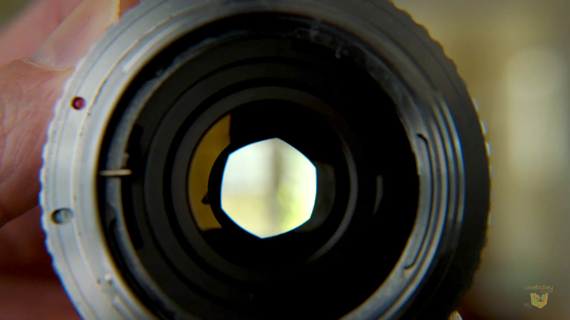 Aperture ring on a 50mm lens, closed down partially to an f/5.6