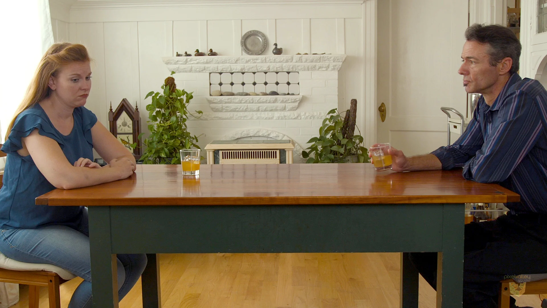 Both are not equal in the shot, symmetrical balance. No one has “power” visually over the other.