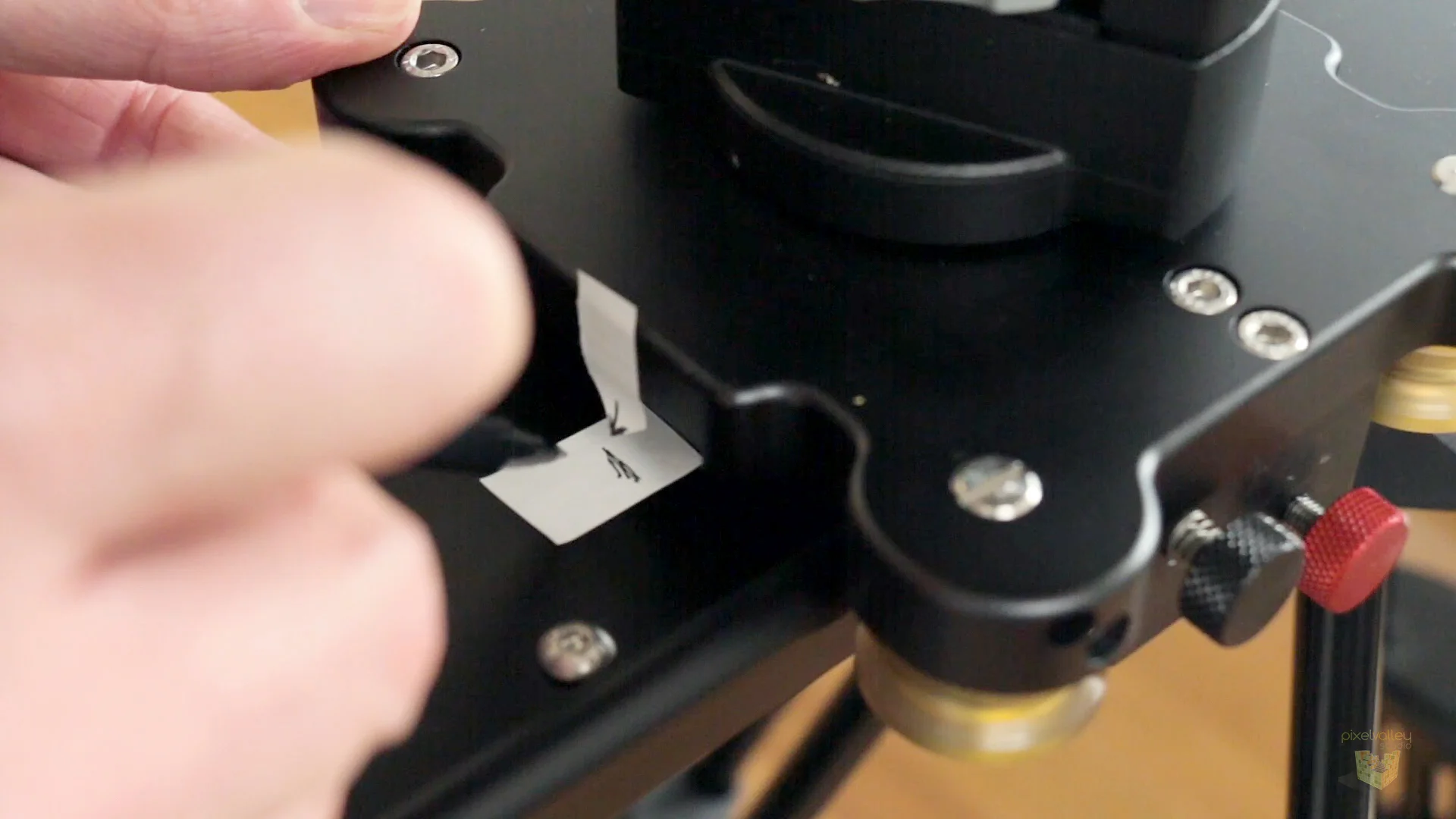 Taping a pointer to the slider base that points down to our starting mark.