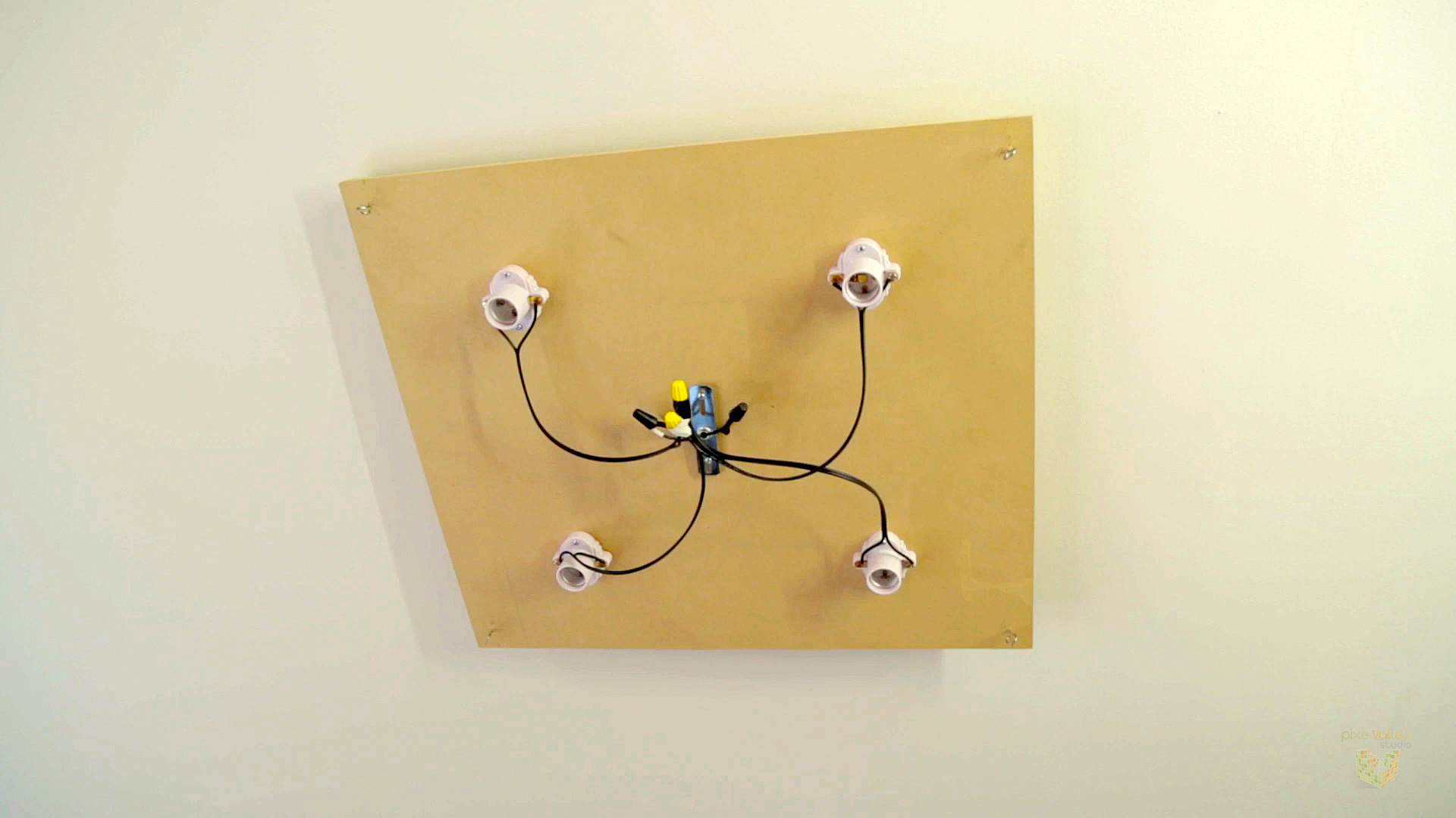 Four Edison sockets mounted to 1/4” MDF for our box light base.