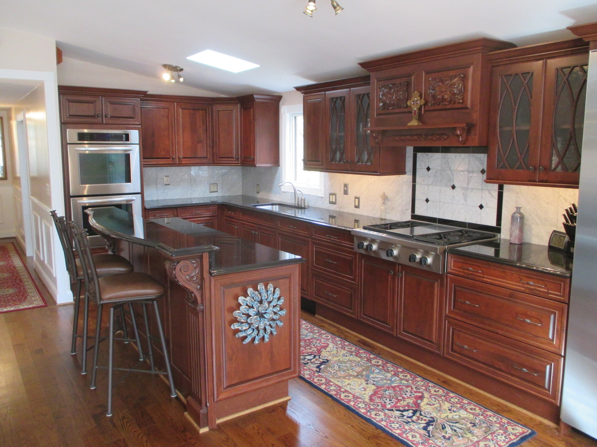 Open Kitchen with Cherry Cabinets and Granite Counters