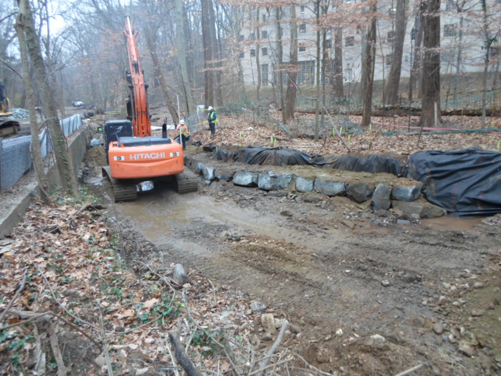 The first layer of stone is placed according to survey layout