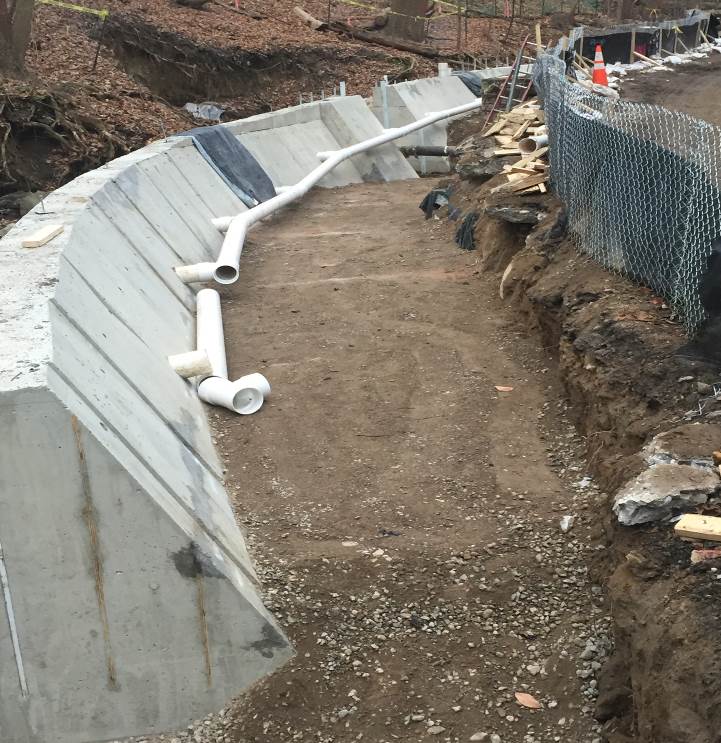 Soil backfill installed to just below the perforated drain pipe level