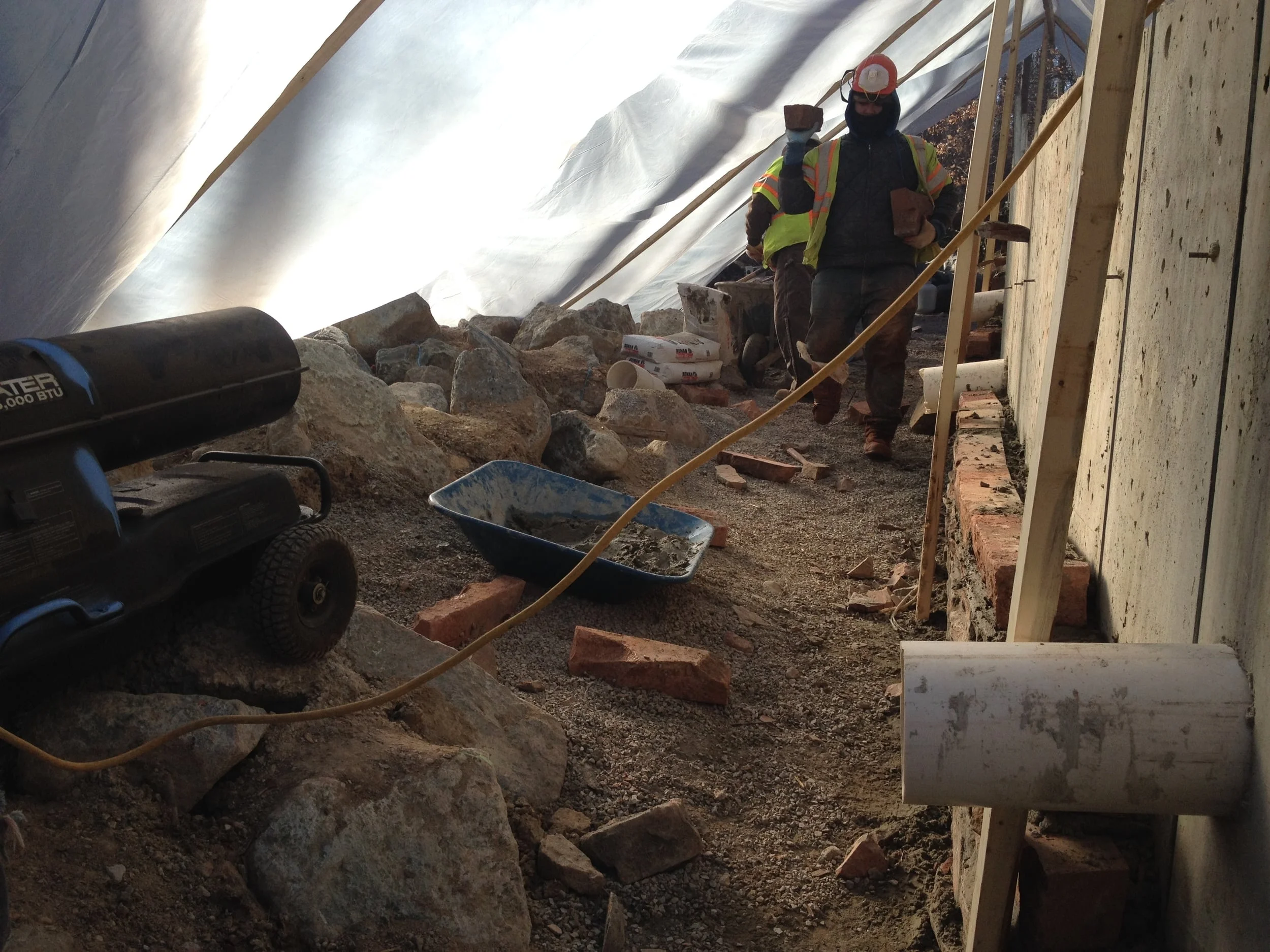 Bullet heaters and temporary tenting allow for mortar to cure as designed.
