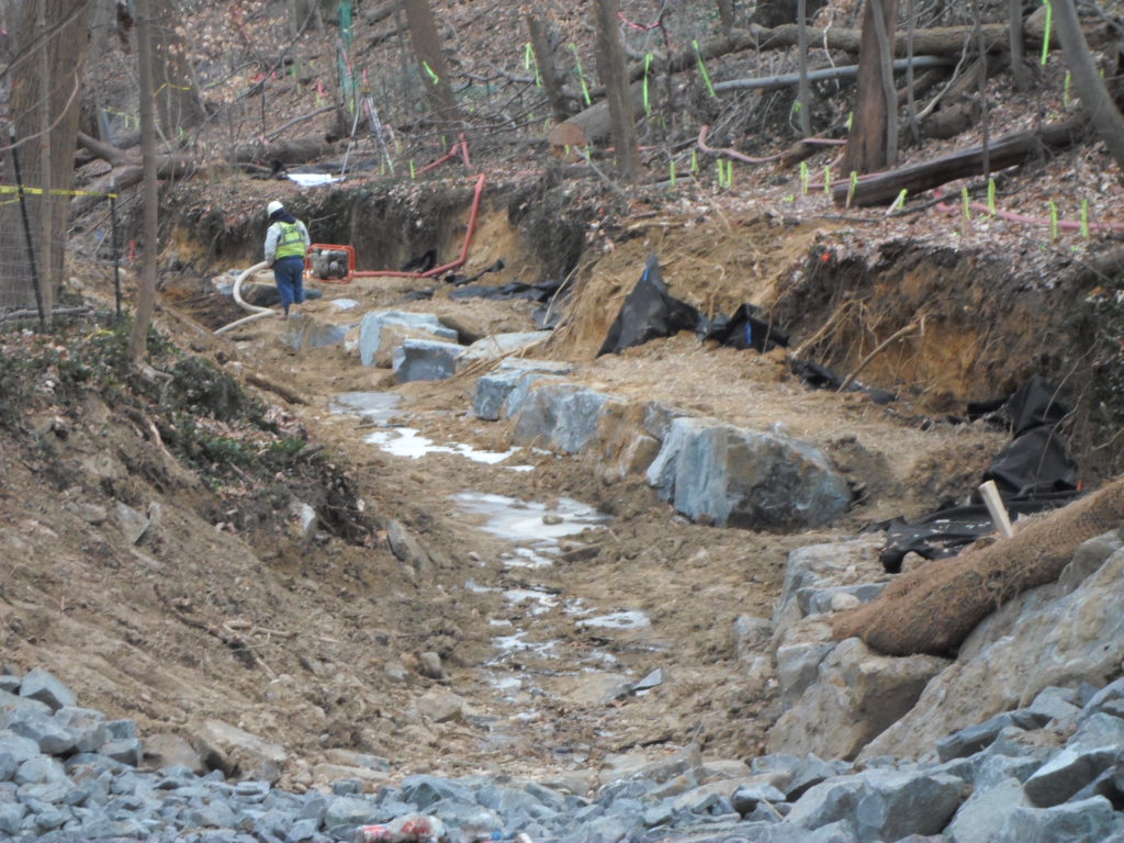 Stone toe (i.e. stream bank armoring) in progress on the upper reach.
