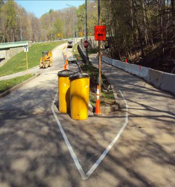 Setting up the work zone for sidewalk construction from Porter Street to the connector trail