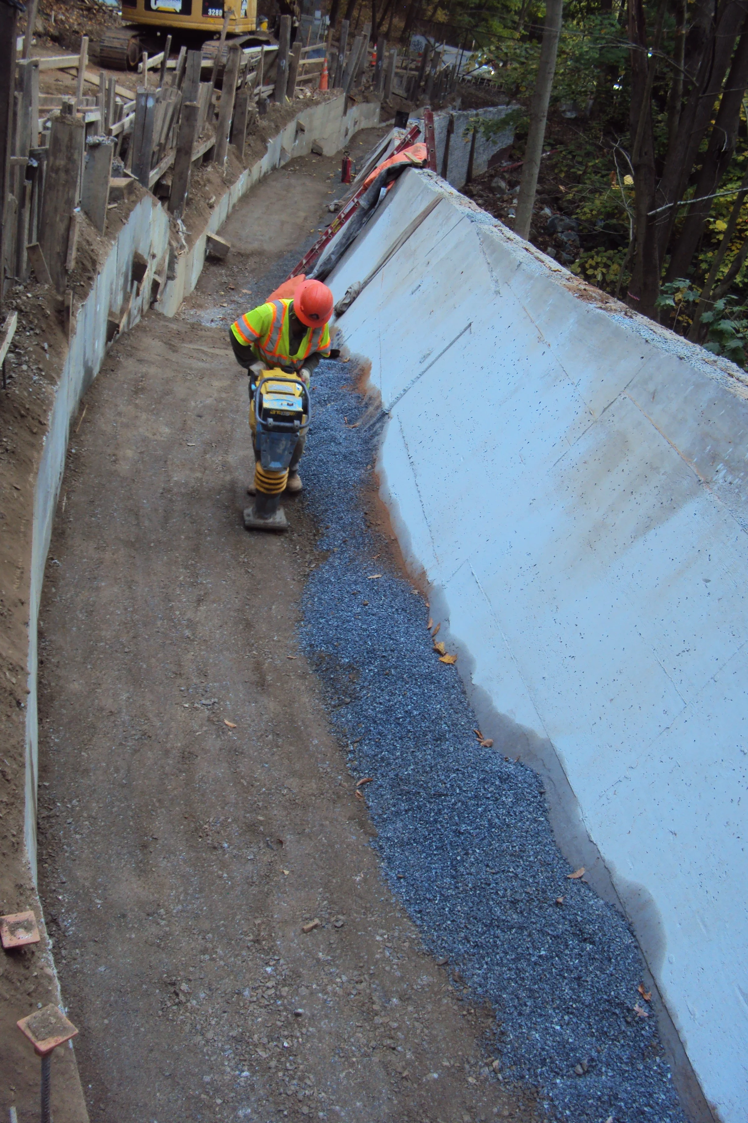 Compaction of backfill behind the gravity wall.