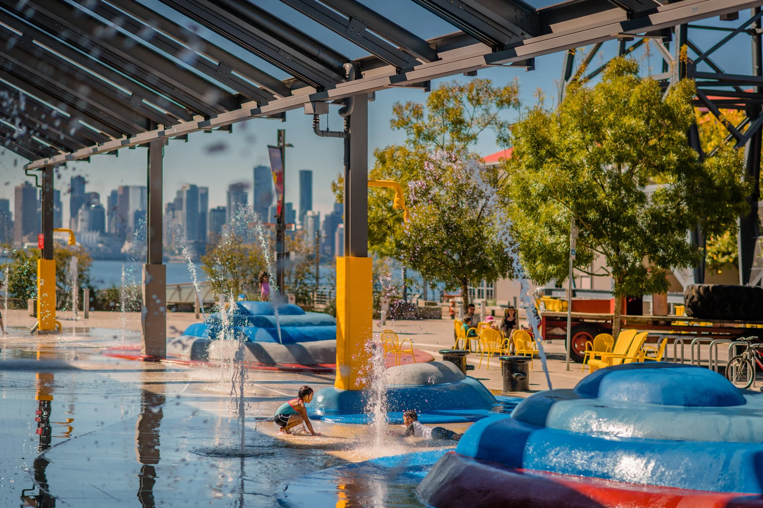 Cooling effect of water features in urban space on people and buildings