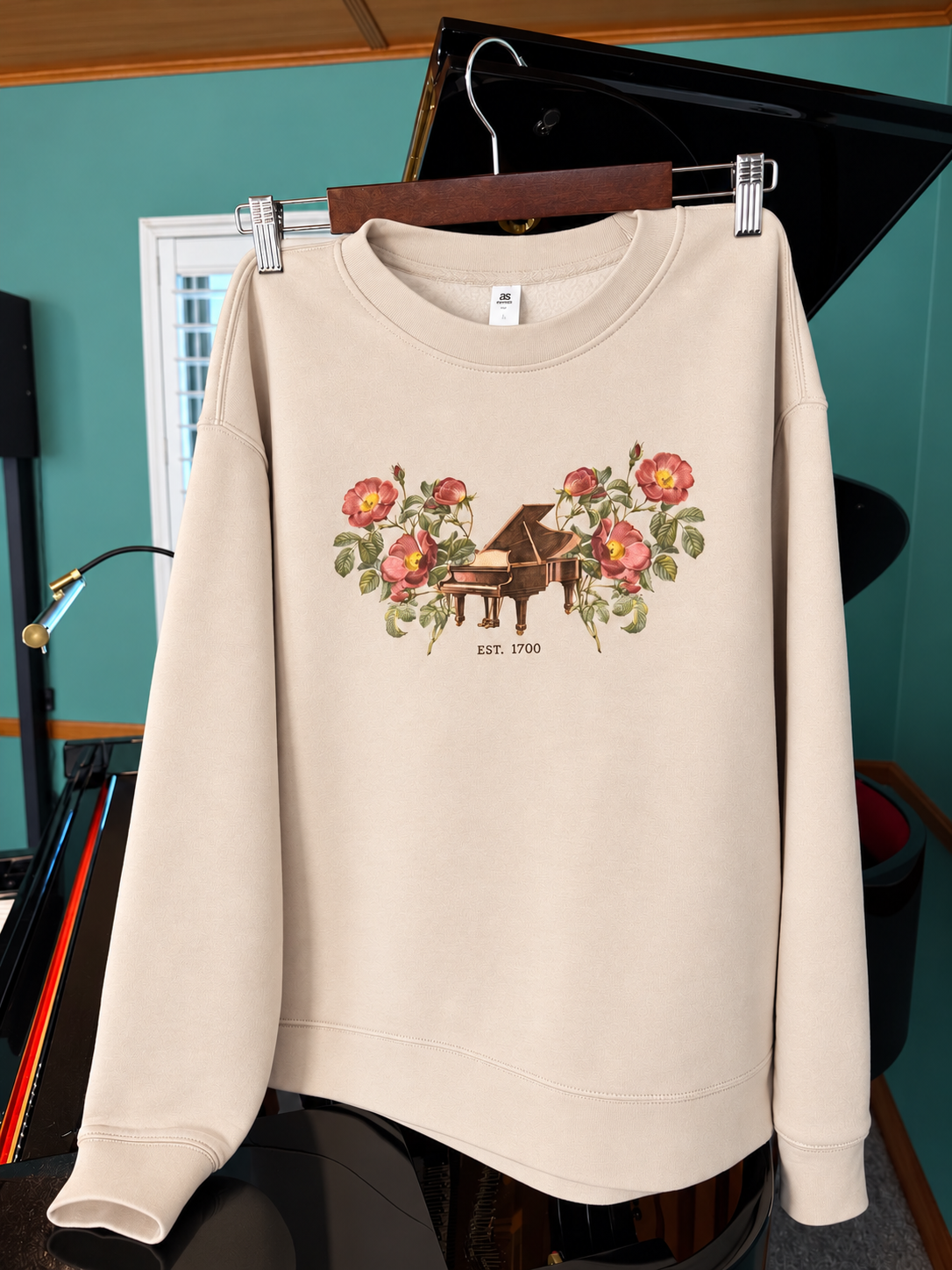 Floral piano sweatshirt hanging.PNG