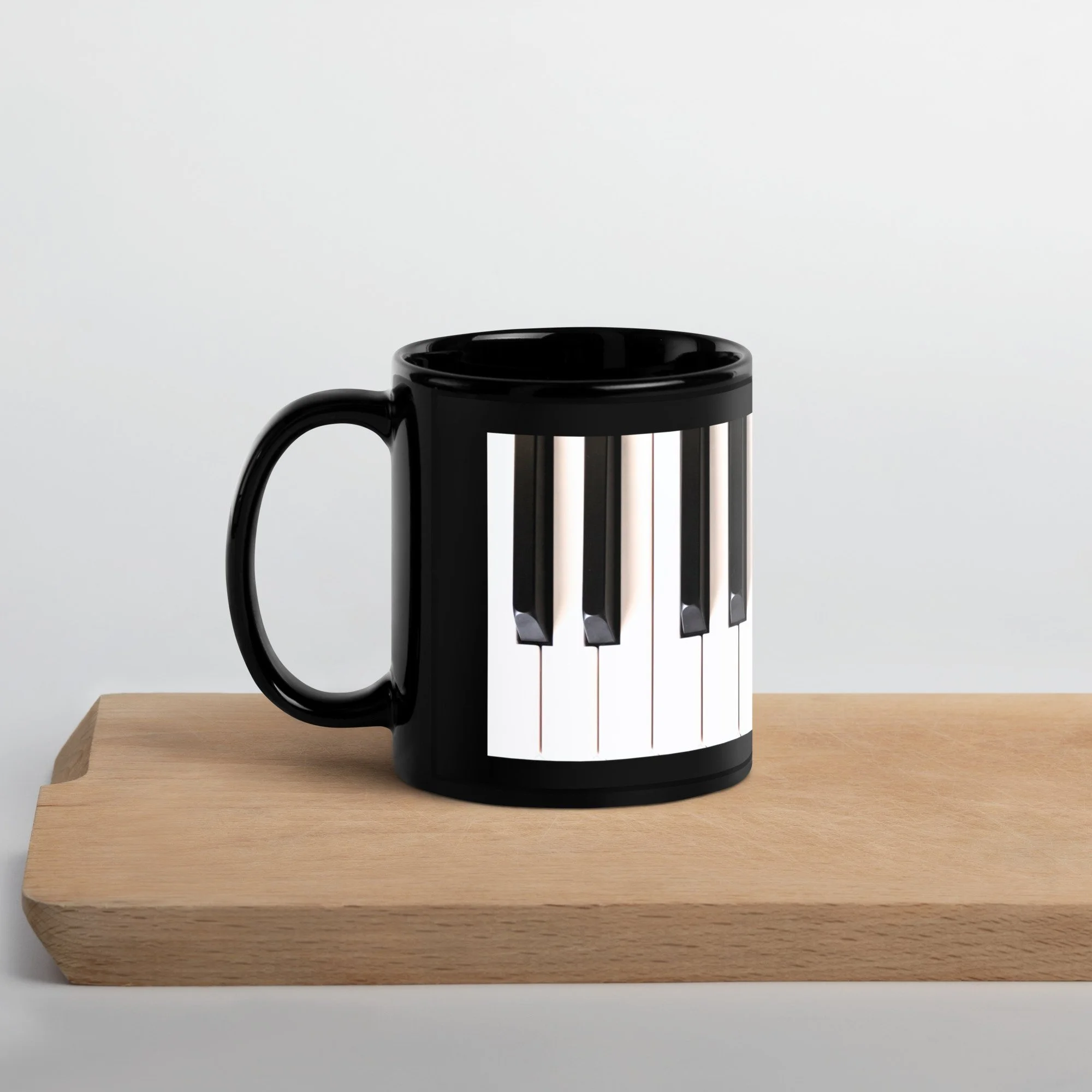 black-glossy-mug-black-11-oz-handle-on-left-68ef19a8c5a95.jpg