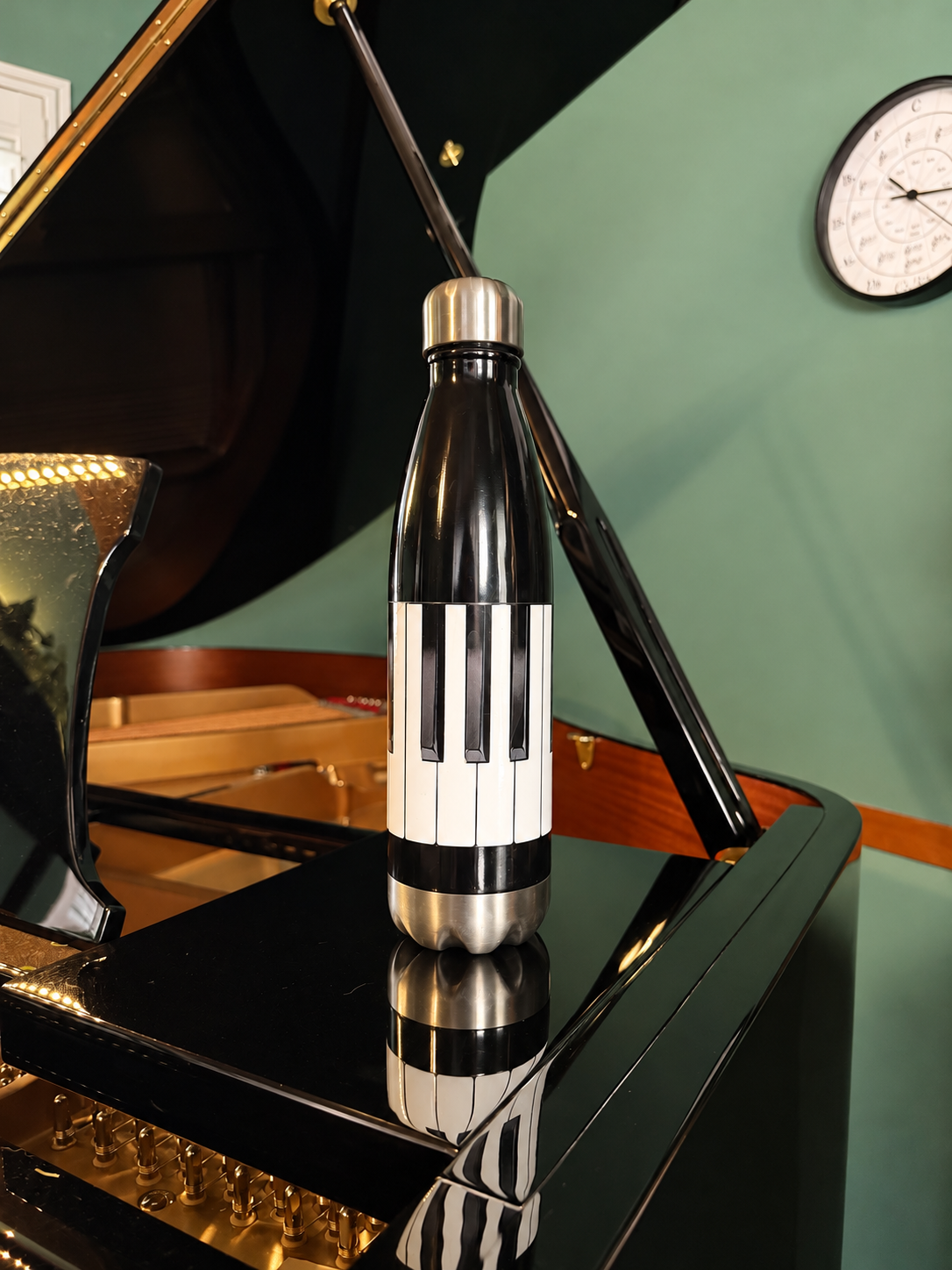 keys water bottle on piano.PNG