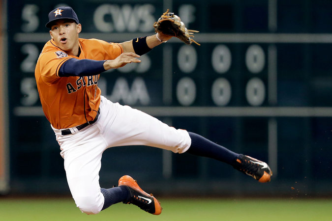 Carlos Correa, master of fielding, hitting, and proper hosiery styling.