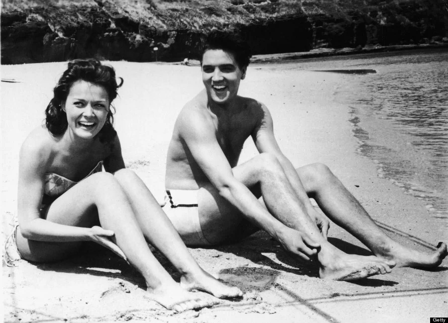 Working hard / hardly working: Elvis on the set of Blue Hawaii.
