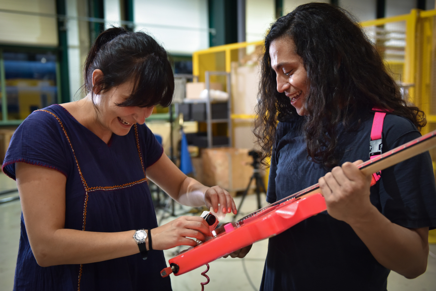 CERN’s Noemi Caraban with Deerhoof guitarist Ed Rodriguez in SM-18 (Image: Marine Bass/CERN)