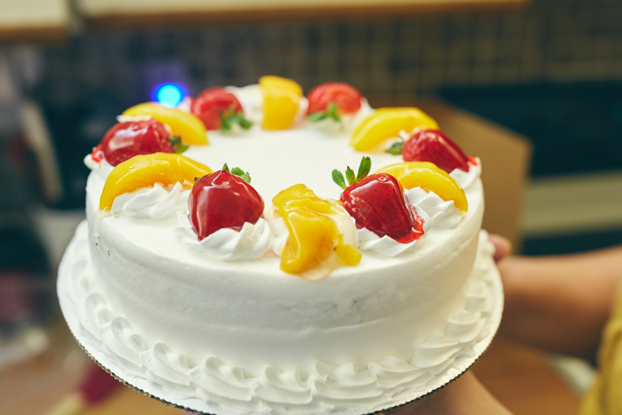 Story behind this cake. We all wanted dessert, something like a cheesecake. It was decided that we were going to get a "Tres leches" dessert. Well, my mom was recommended this Mexican bakery, we were a little bit surprised when we were asked for fruit. When we picked it up we realized it was a "Tres leches" cake and not a dessert, bummer!