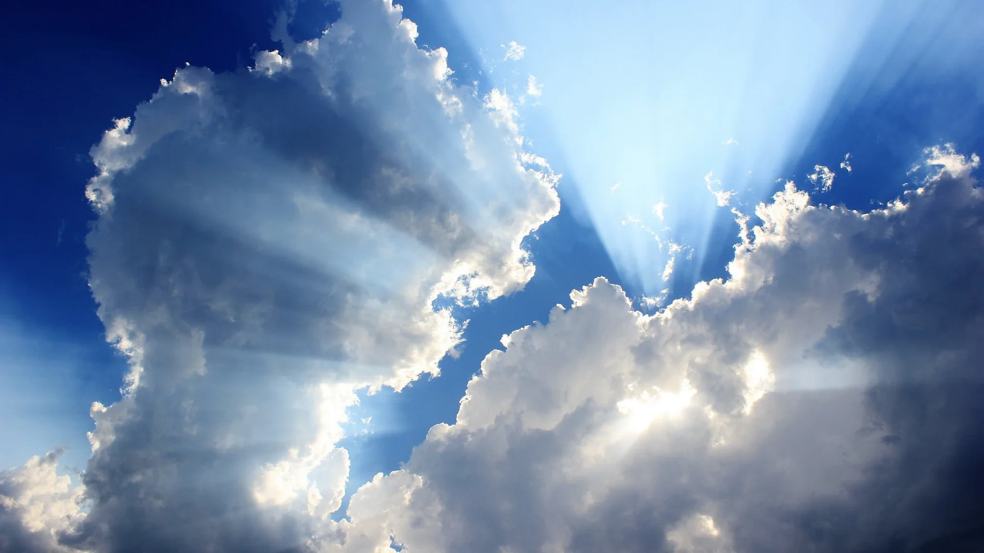 Blue-sky-white-clouds-sun-rays-Wallpaper.jpg