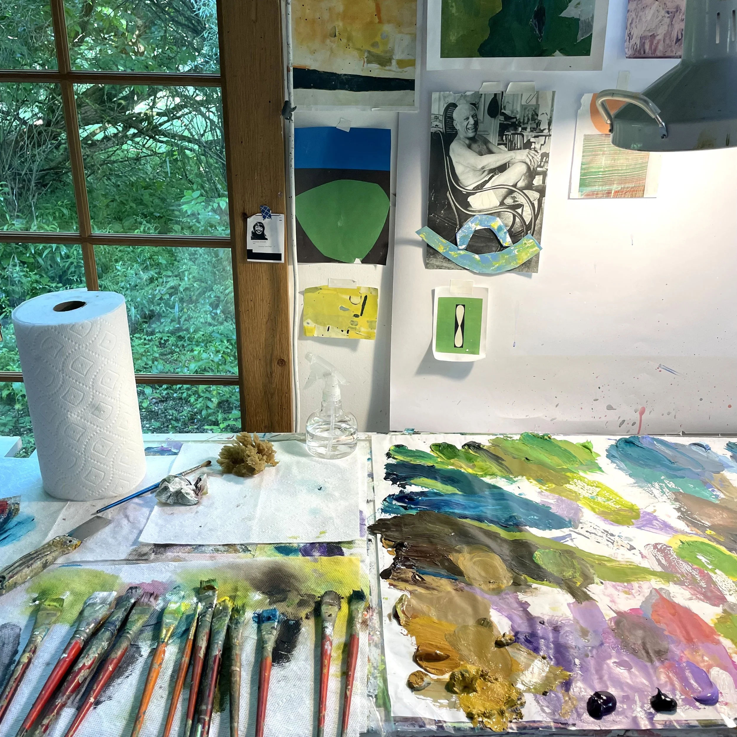  Quick shot of my palette table, after a painting session. Picasso is always there laughing with me, or at me —not sure!   ;)   .   