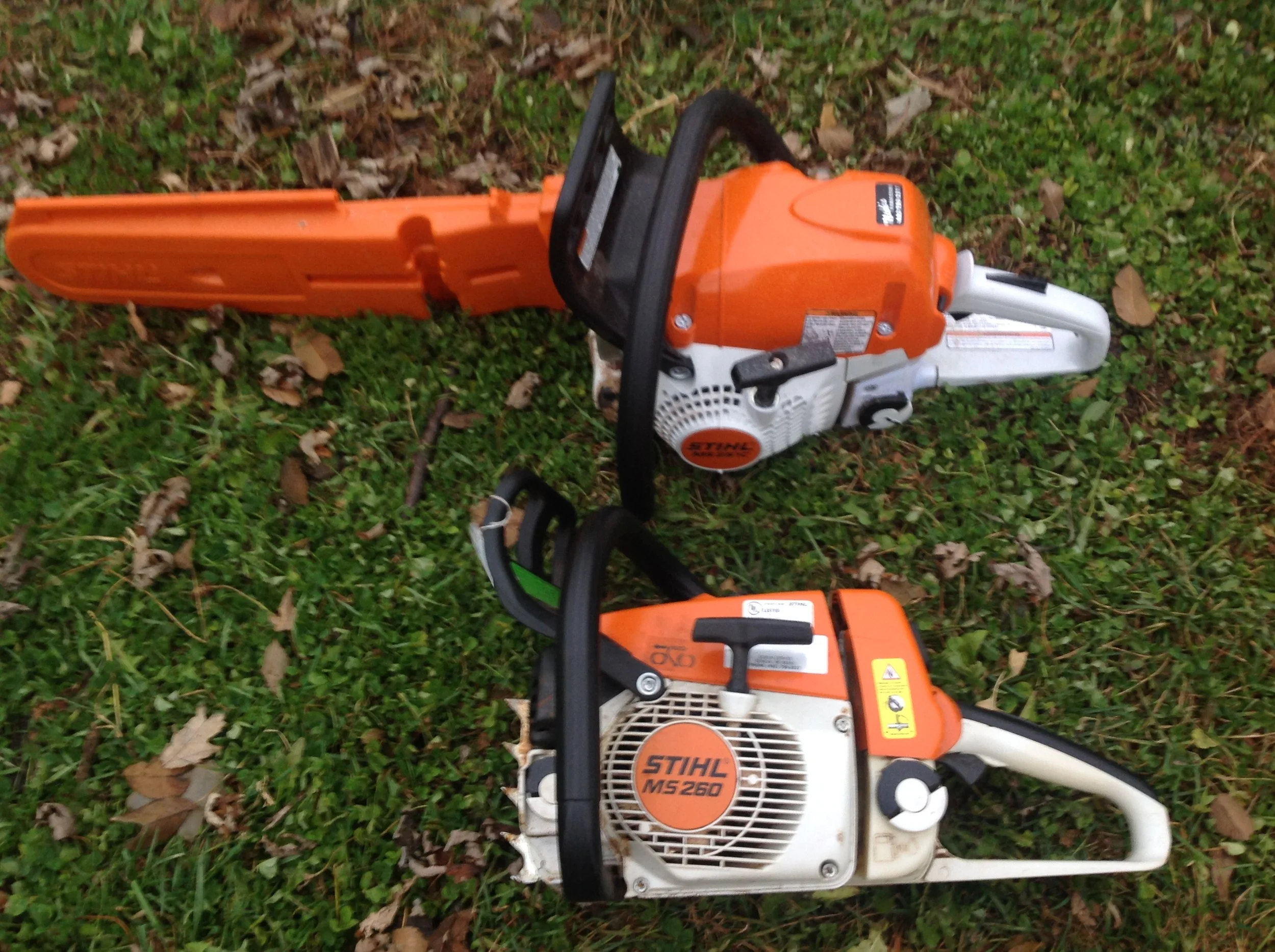 The old MS 260 on bottom. (See the new screw in the brake handle just above the label?) The new saw, a 251C, on top. Now, I'm good to go!