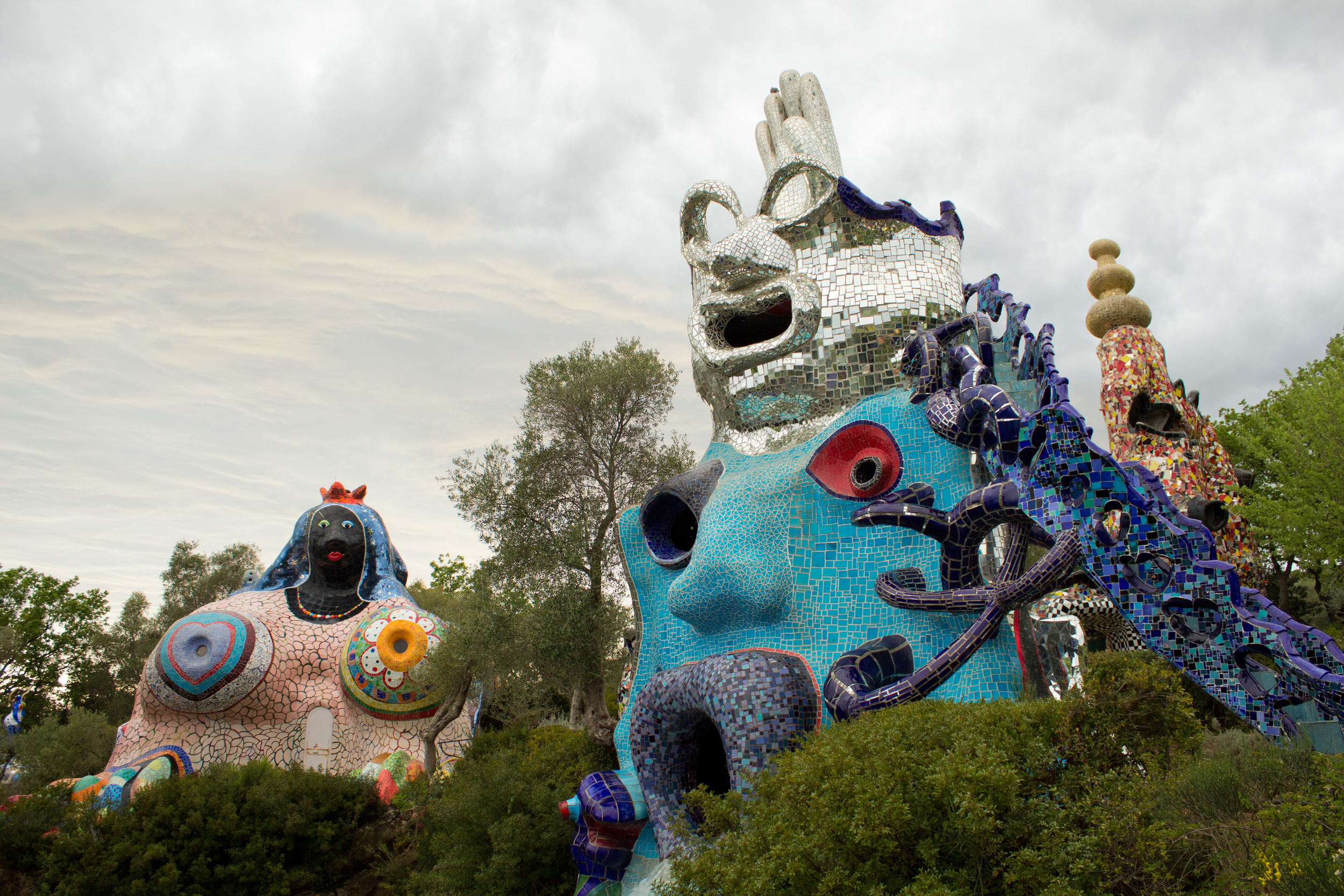  Explore the fantastical sculptures in Niki de Saint Phalle's larger-than-life Il Giardino dei Tarocchi. 