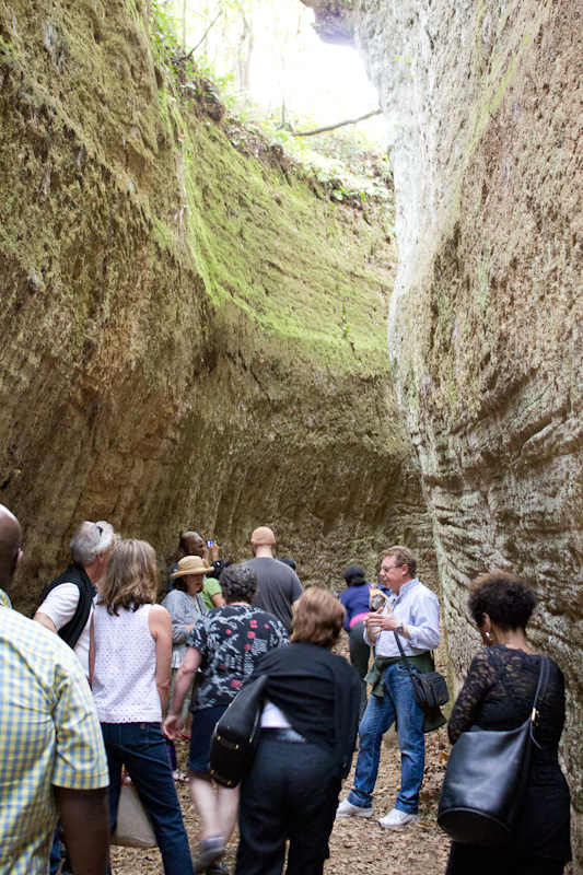  Local guide Carlo Rosati leads participants through ancient hand-carved tufo stone passageways. 