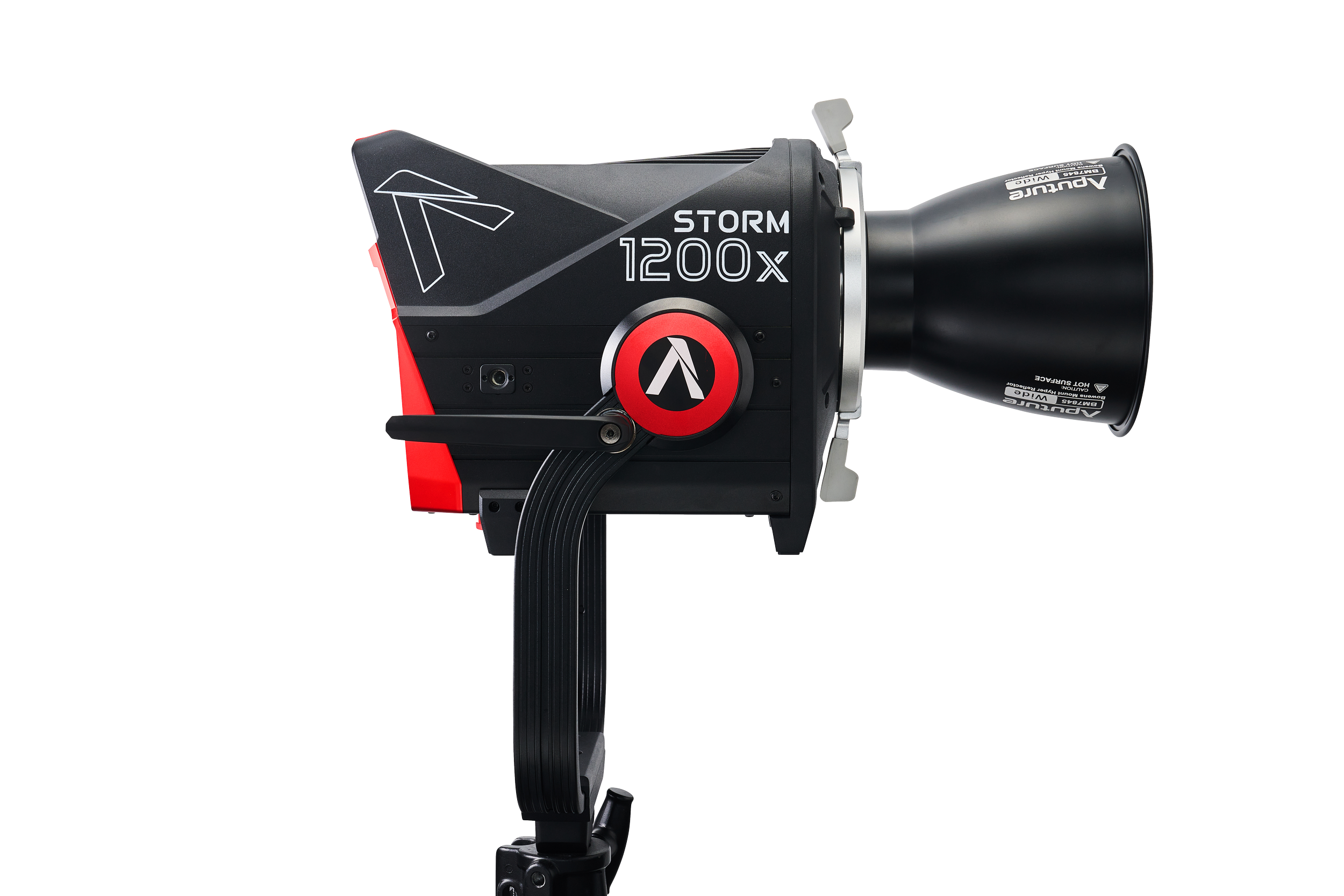 Black and red professional camera lens with brand name and specifications, mounted on a tripod