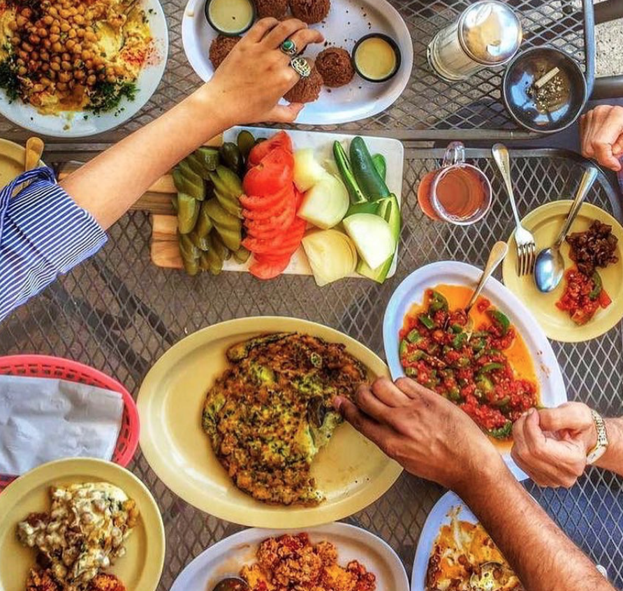 Picture of People Eating At Kareems.png