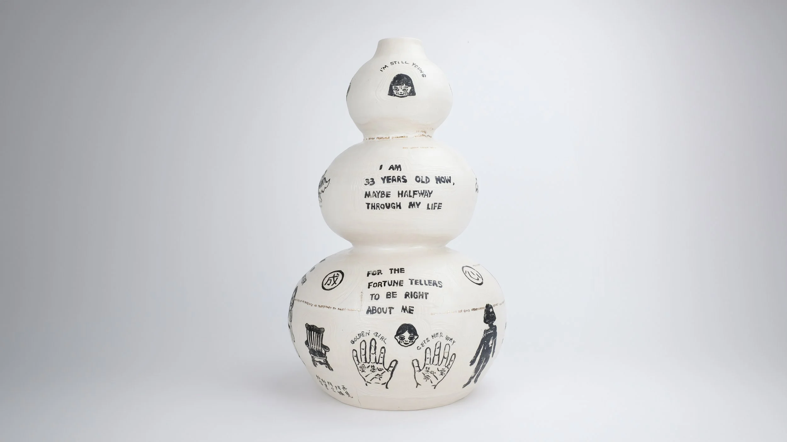 Age 33, 2025, Block print underglaze on porcelain with matte clear glaze, electric-fired with gold kintsugi words, 11” x 11” x 18”