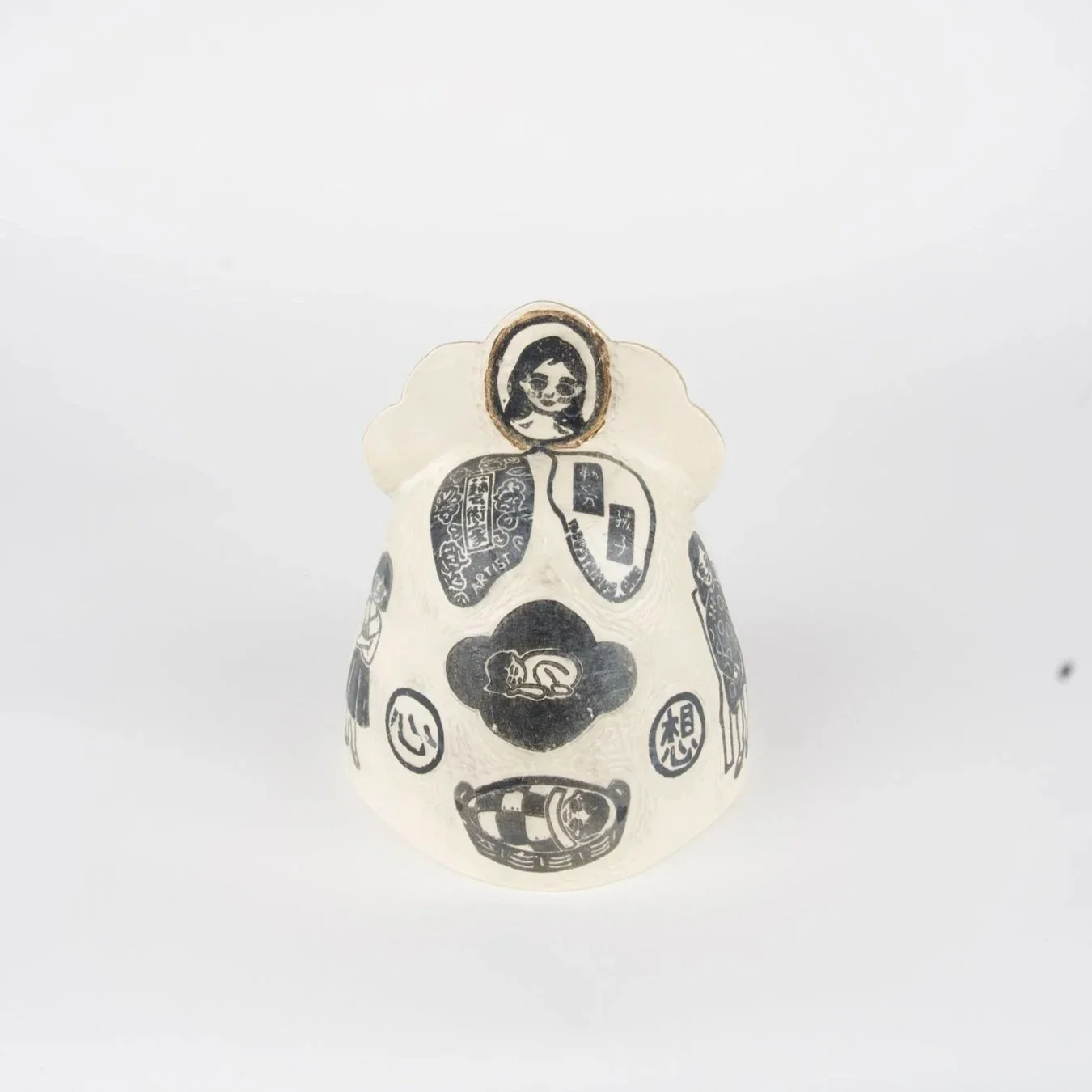 Child Bell, 2025, Block printed and carved porcelain with gold luster, 9" x 7" x 7”

