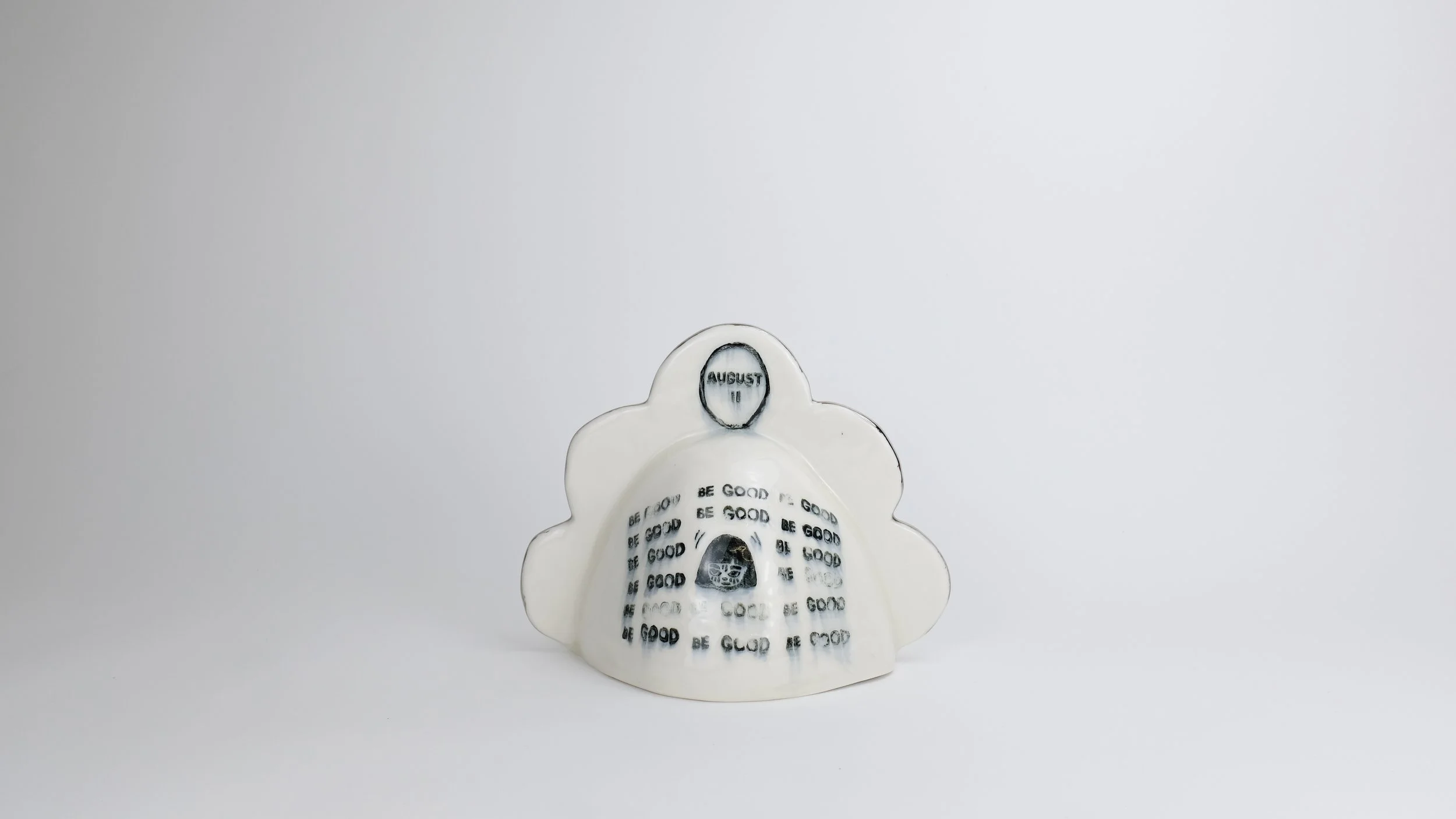 August 11 Bell (Be Good), 2025, Block print underglaze on porcelain with clear glaze, electric-fired with platinum luster, 9” x 8” x 9”