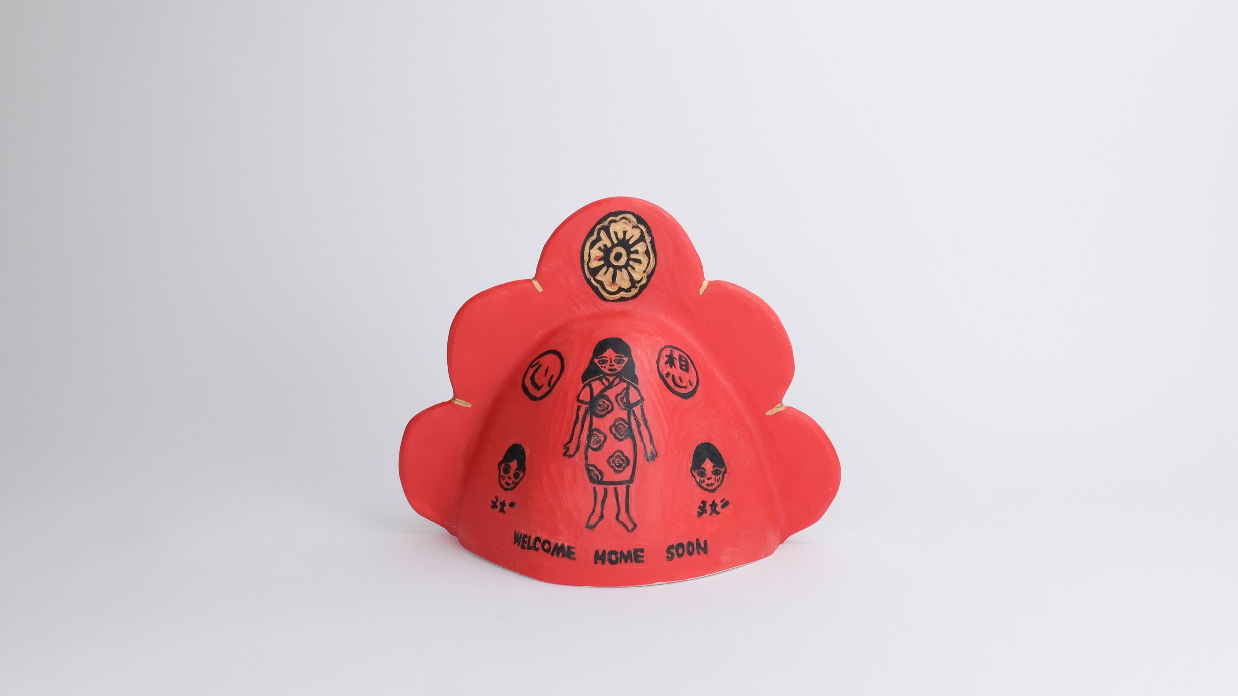 August 6 Bell (Welcome Home Soon), 2025, Block print underglaze on porcelain, red underglaze, electric-fired with gold luster, 9” x 8” x 9”