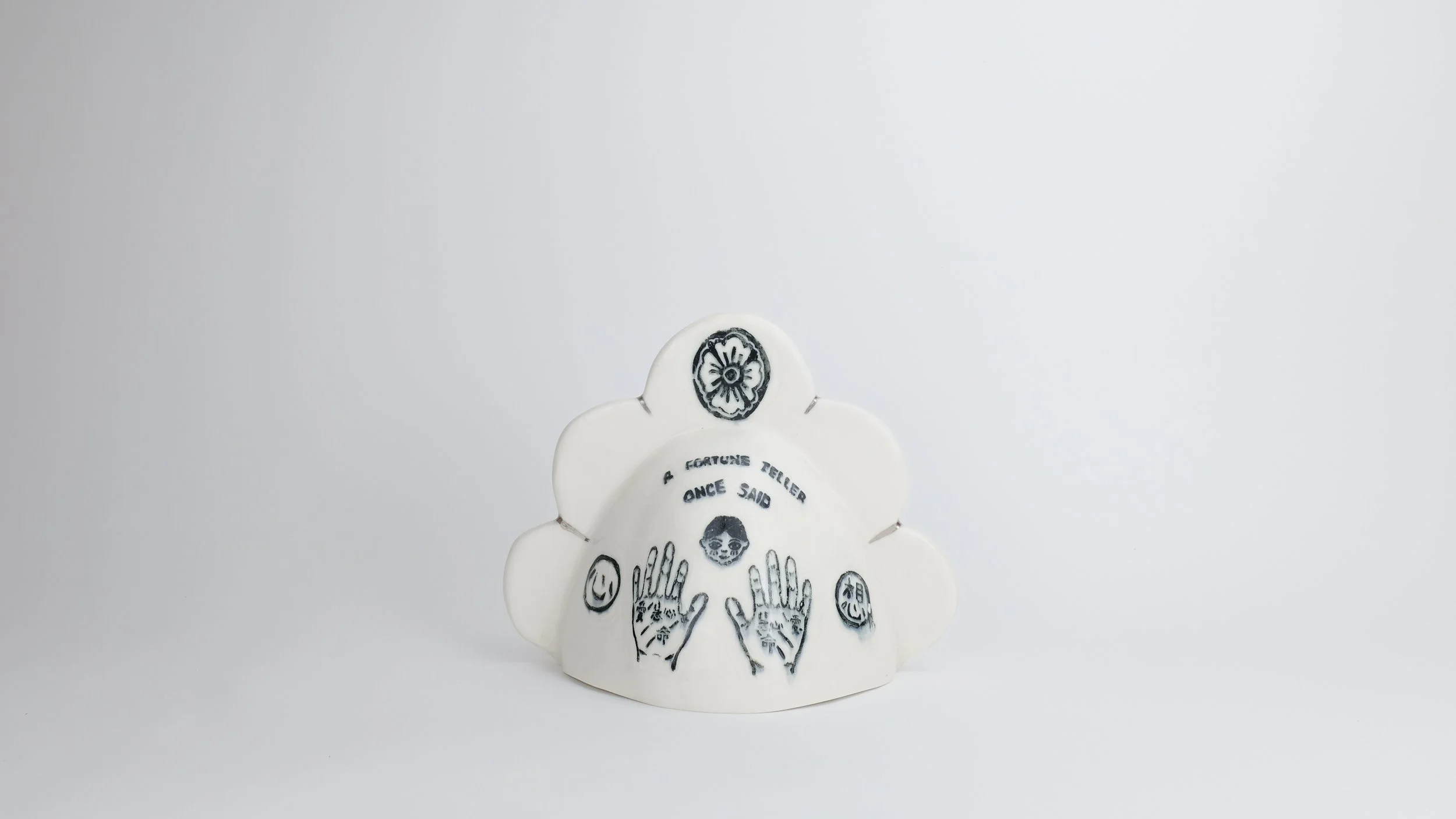 August 2 Bell (A Fortune Teller Once Said), 2025, Block print underglaze on porcelain with clear glaze, electric-fired with platinum luster, 9” x 8” x 9”
