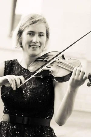 Ūla Kinderytė and Adam Cockerham Perform To Support The School