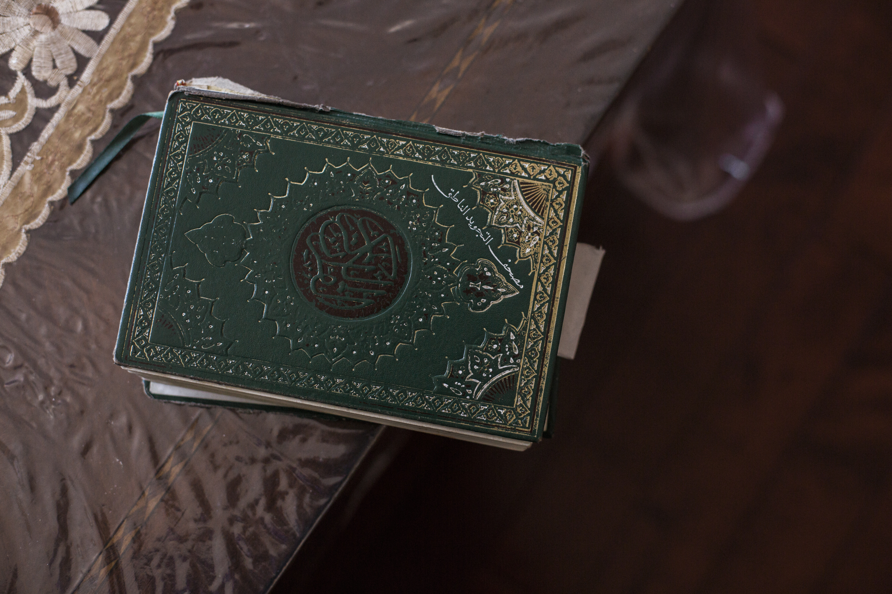 A koran sitting on the coffee table at Huda's childhood home in Greenpoint, Brooklyn. 
