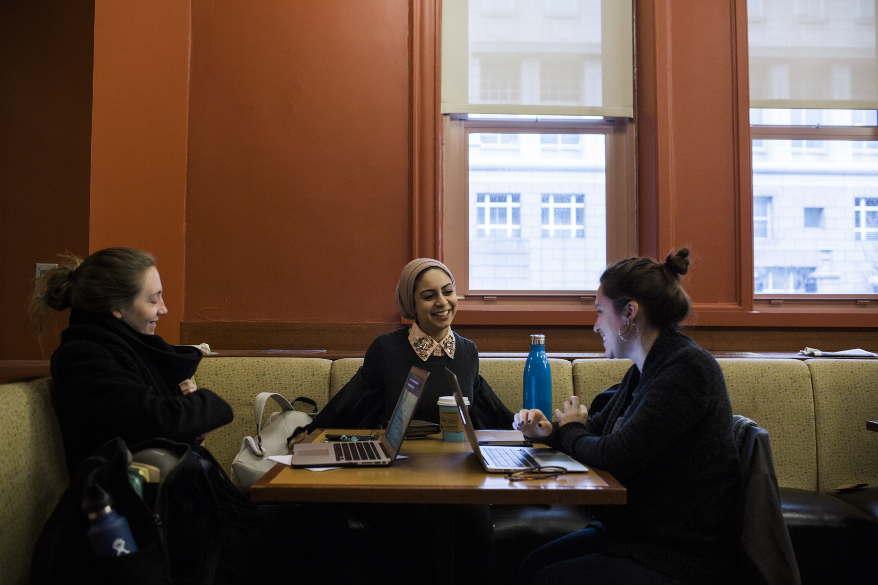 Sarah Alsaidi with members of her cohort catching up before a tutoring session in statistics at Teacher's College in Harlem, Manhattan, New York. 