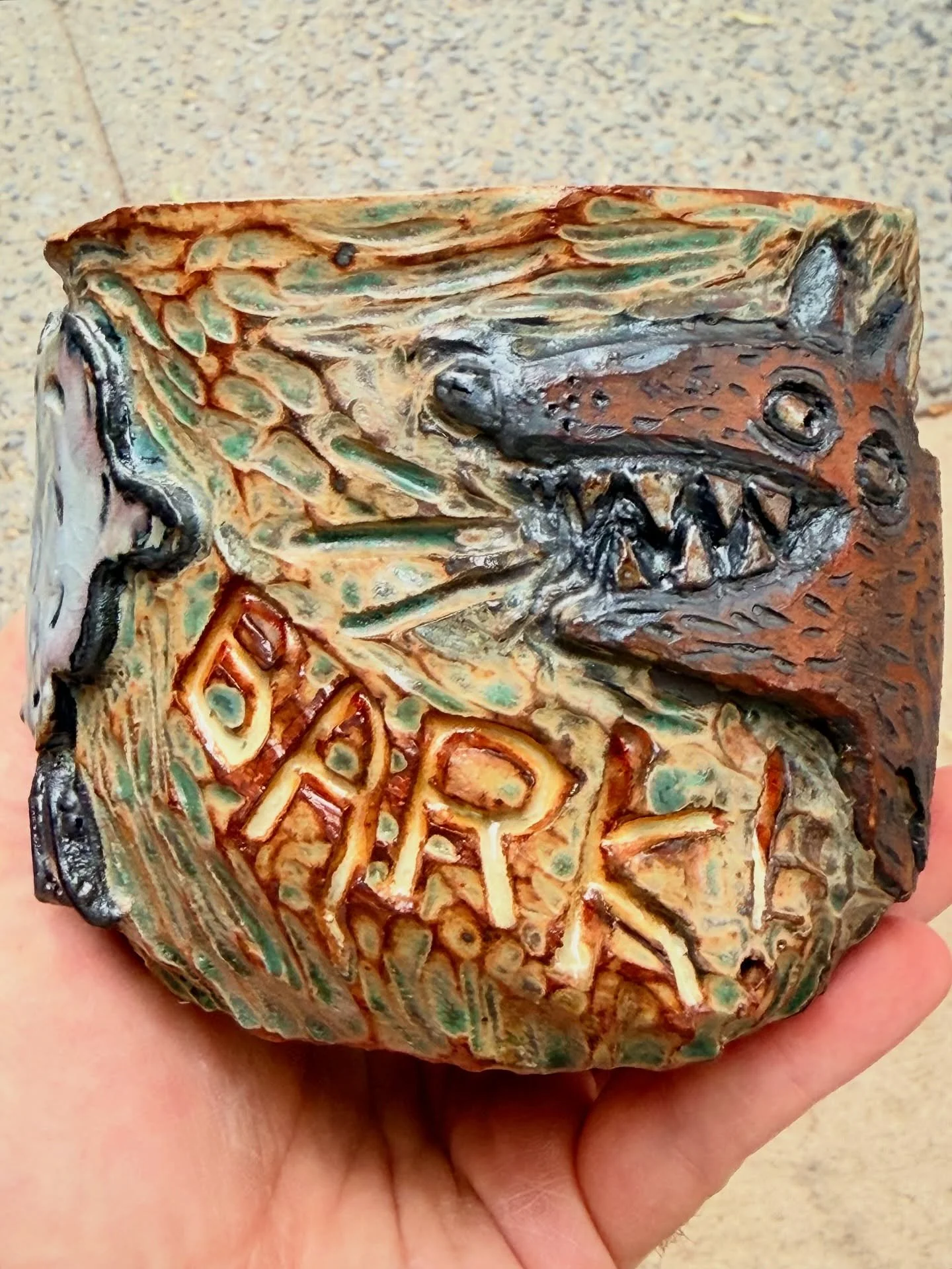 Wolf on a cup smashed into the fourth wall.
