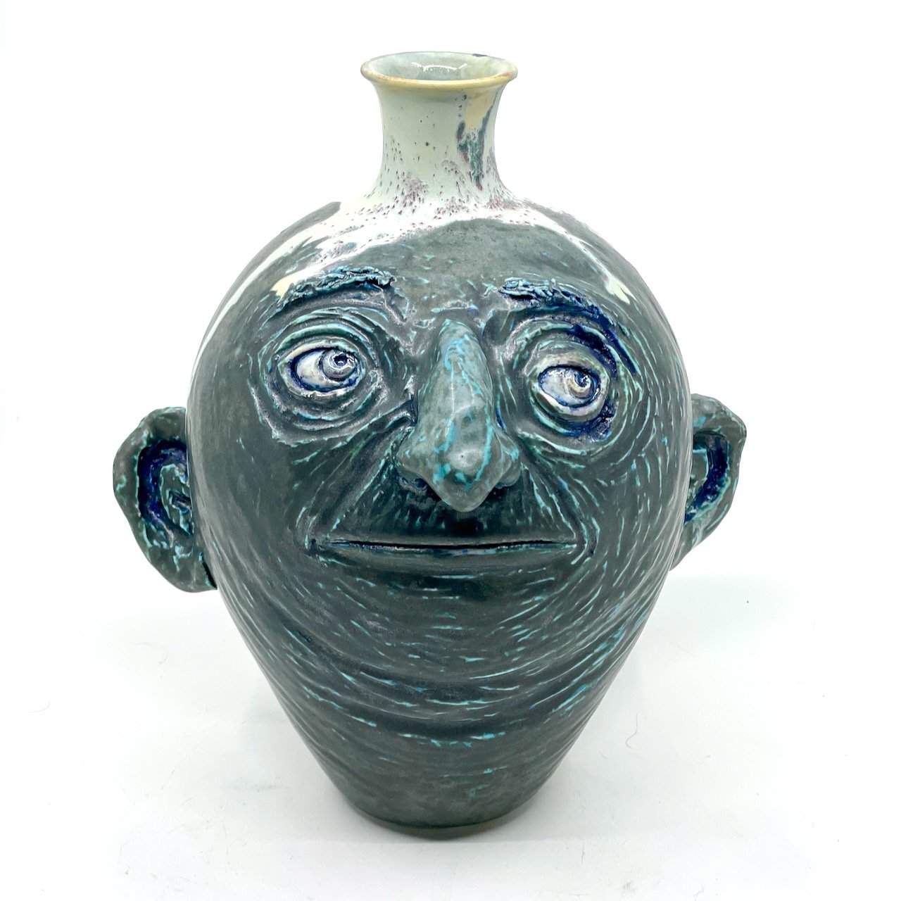 Greenish serious looking porcelain vase
10 x 9 x 7
2025
$