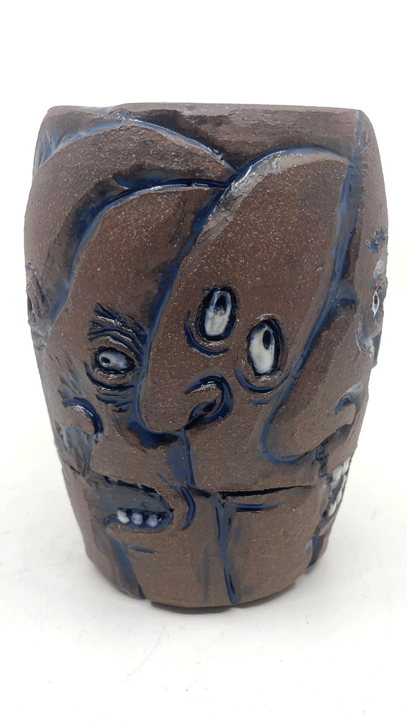 The vase with all the faces.