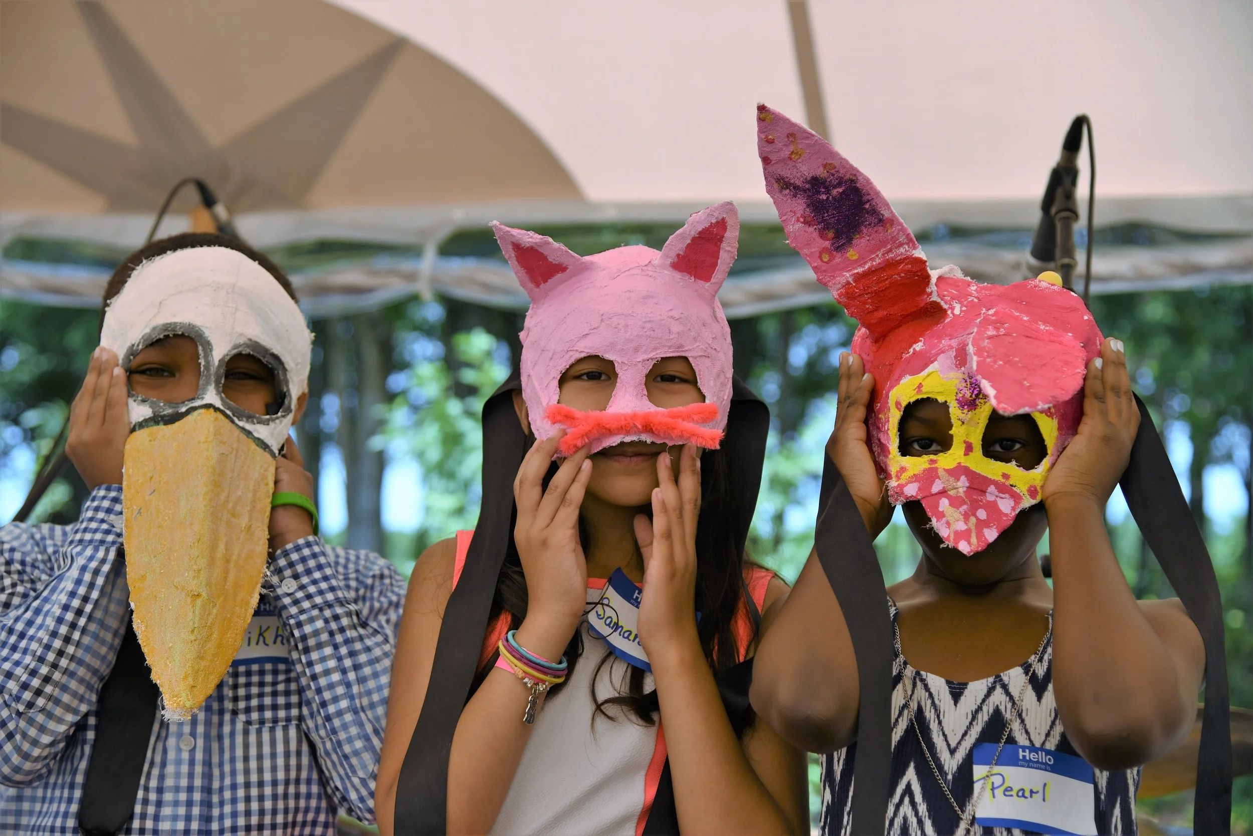 Young Artists In Residence with their masks at the Watermill Center