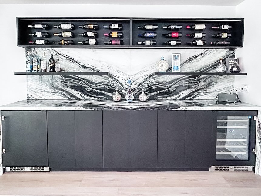 We loved designing this #bar area for our client&rsquo;s home. Not only does it feature two fridges and ample storage in the base cabinets, we added the upper wine storage that is both functional and a beautiful display of their collection! #Cheers ?